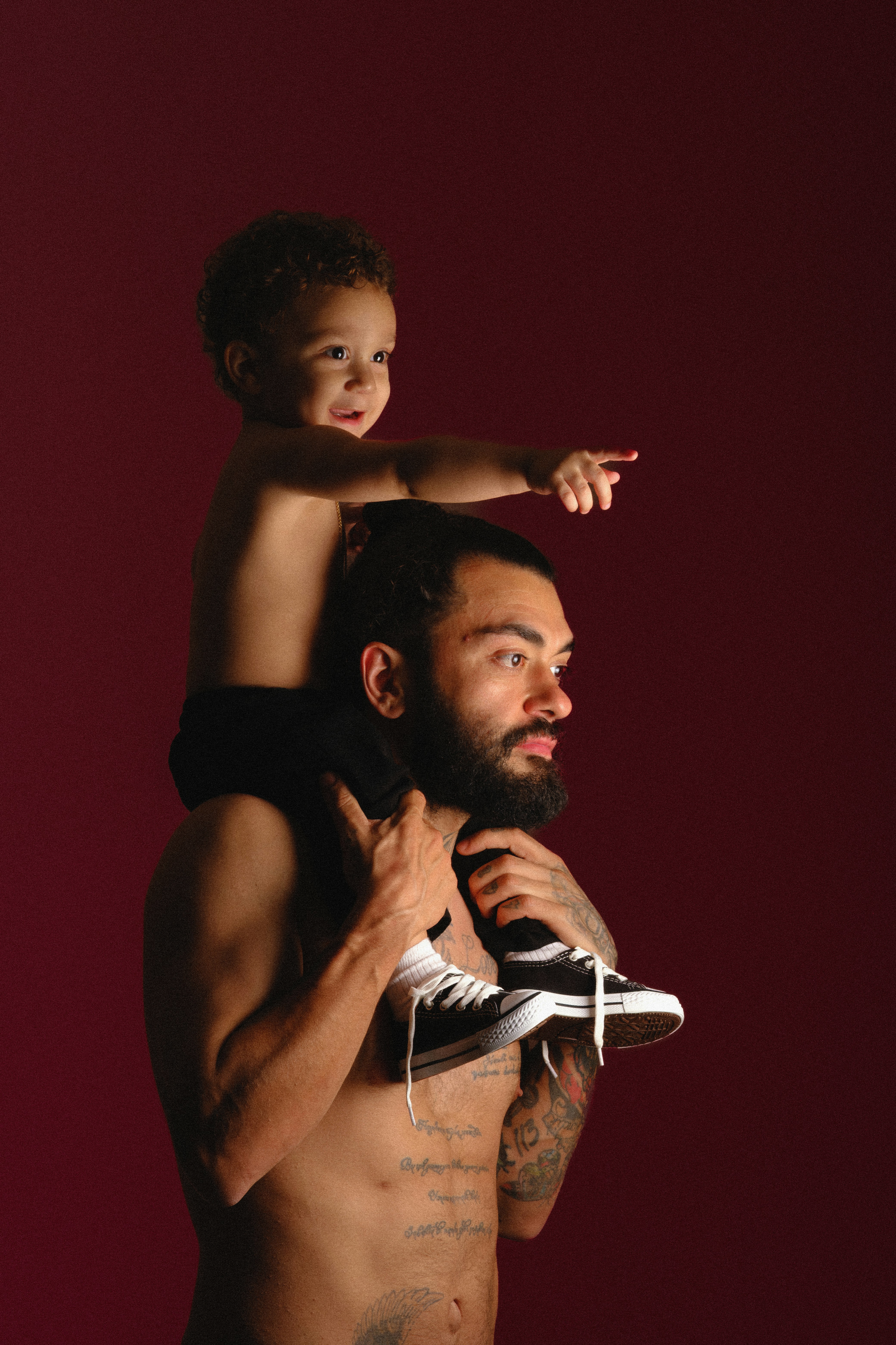 Father carrying his son on his shoulders