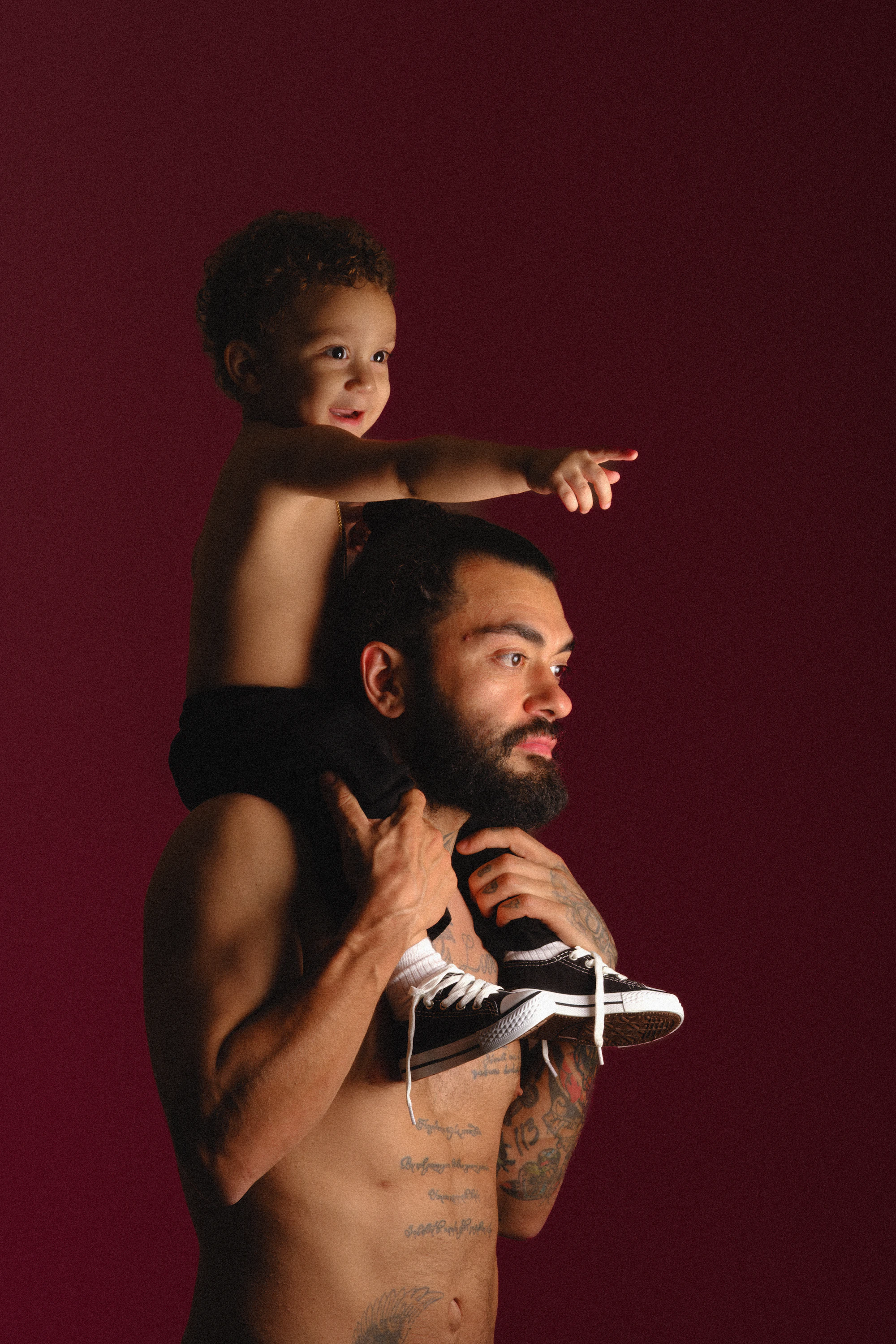 Father carrying his child on his shoulders