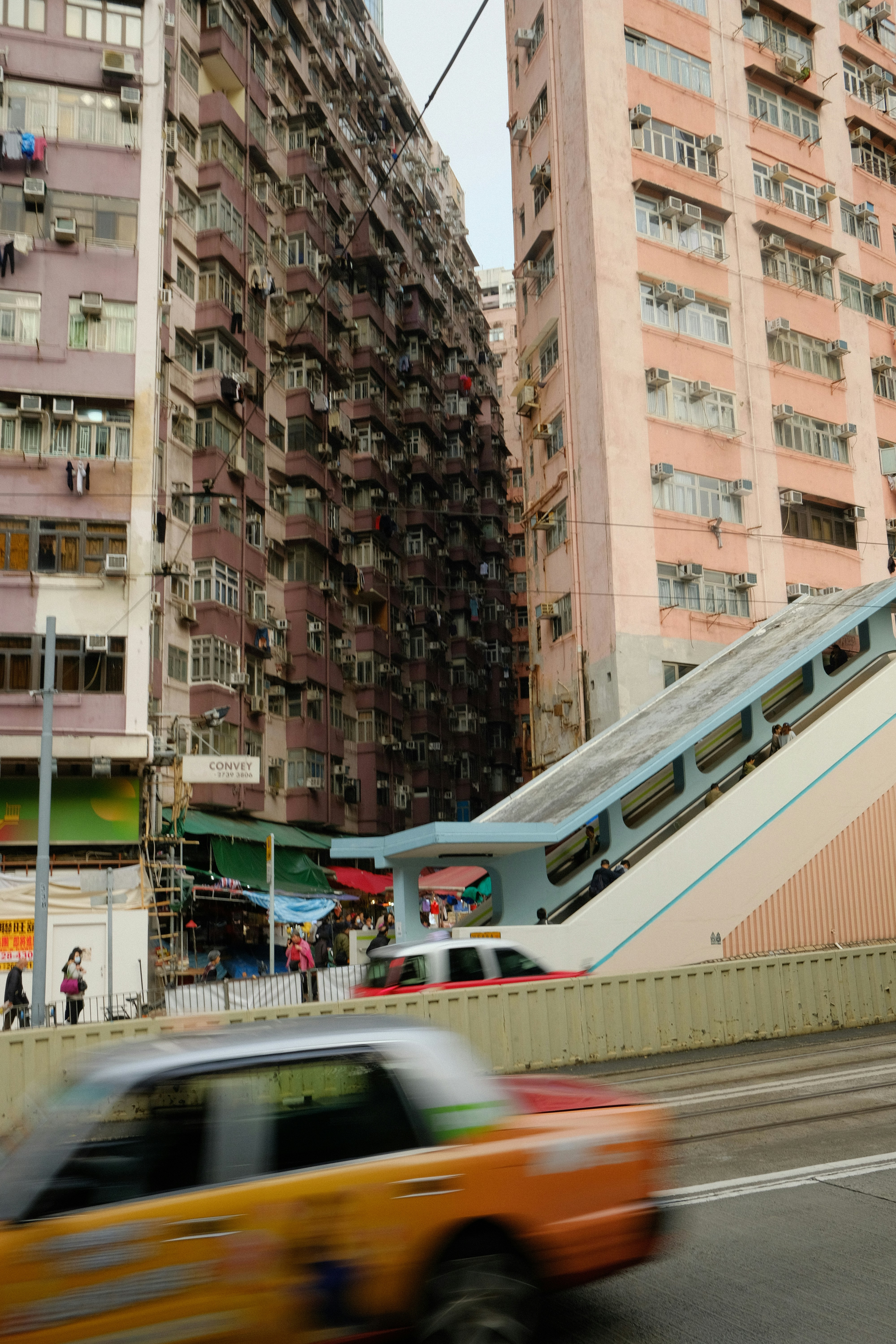 Busy street with yellow taxi and tall buildings