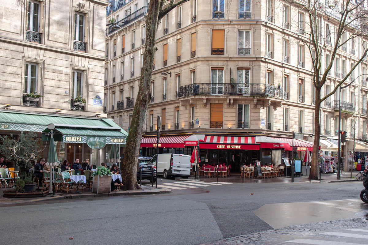 Parisian cafés with outdoor tables along a neighbourhood street