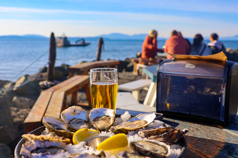 Oysters and a cold drink by the ocean