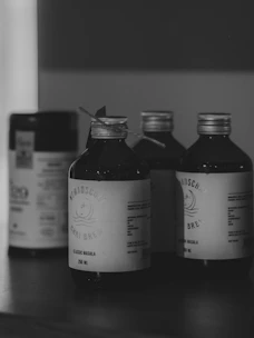 Three bottles of cold brew coffee on a shelf.
