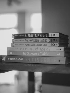Stack of cookbooks on a shelf