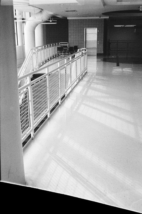 Interior hallway with a ramp and bright floor