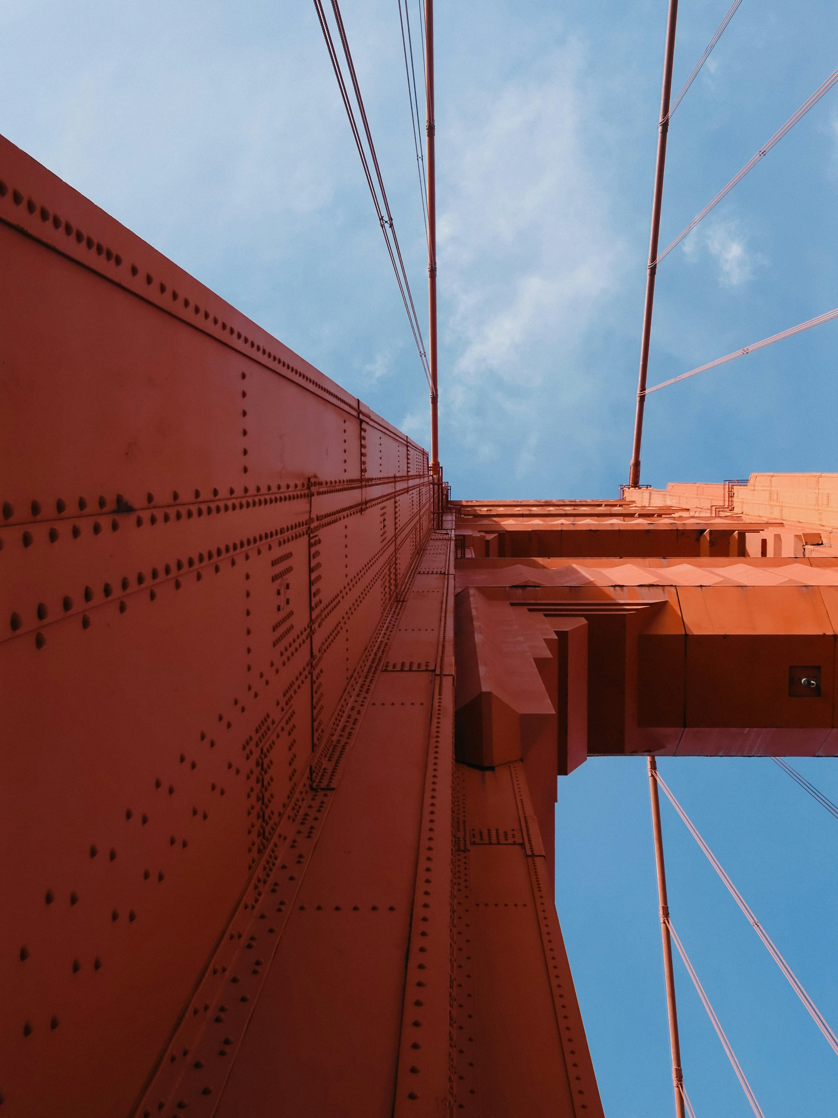 Looking up at the golden gate bridge structure
