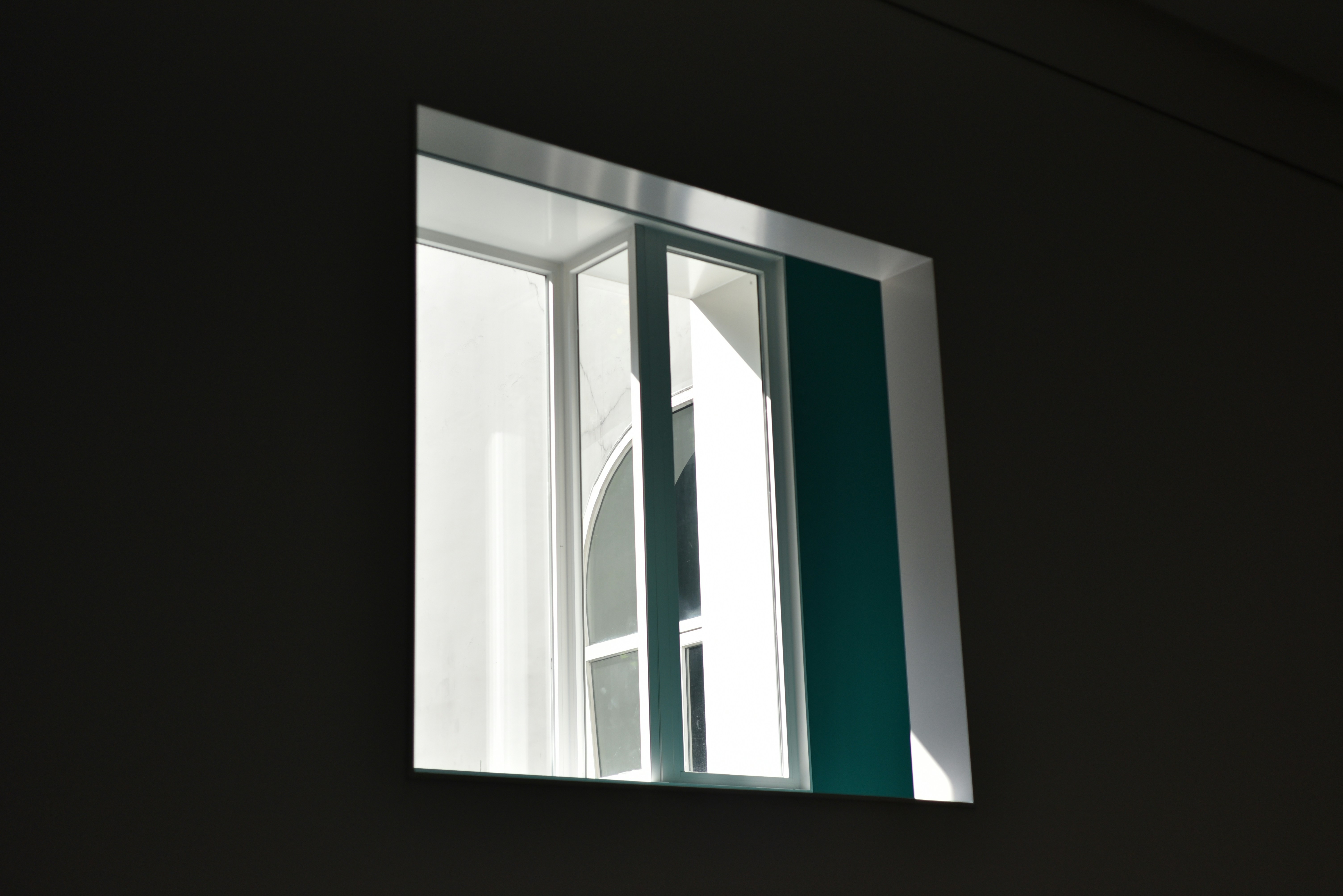 Photo of A modern window with white frames and green blinds. by little Gabriel