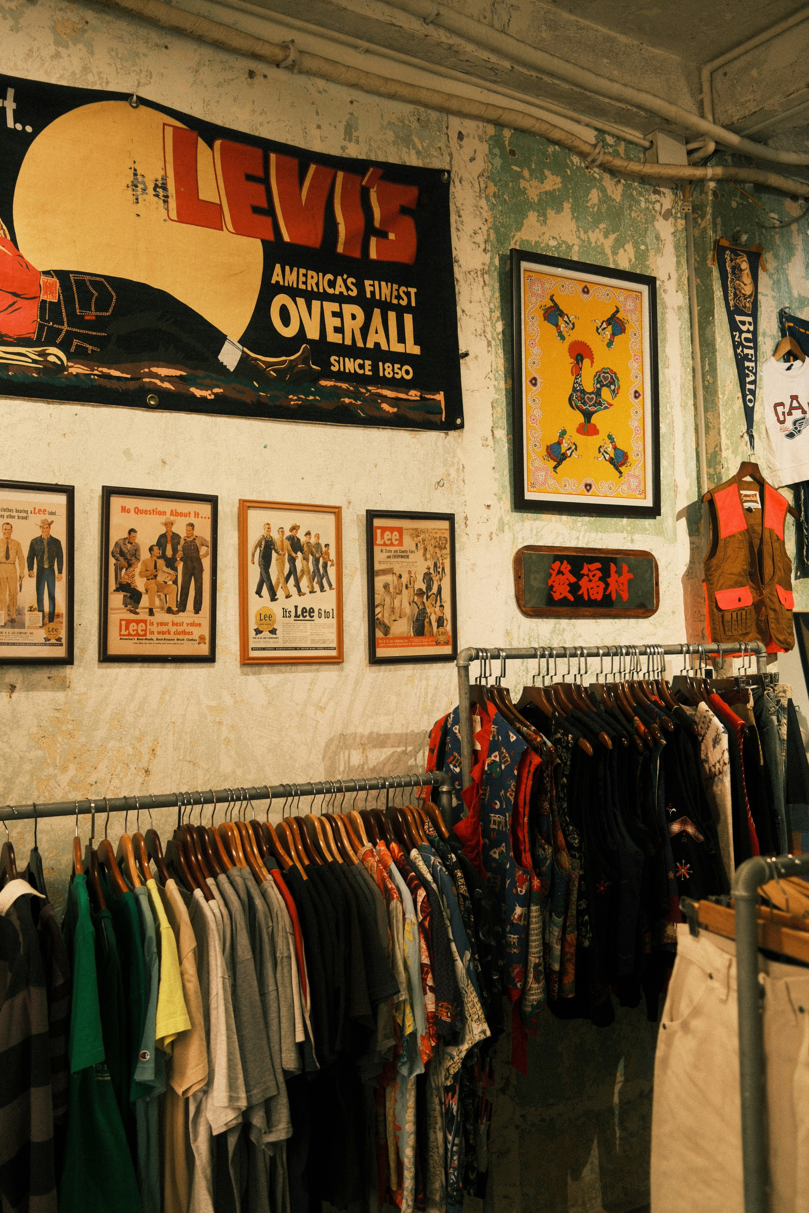 Vintage clothing displayed on racks in a store.