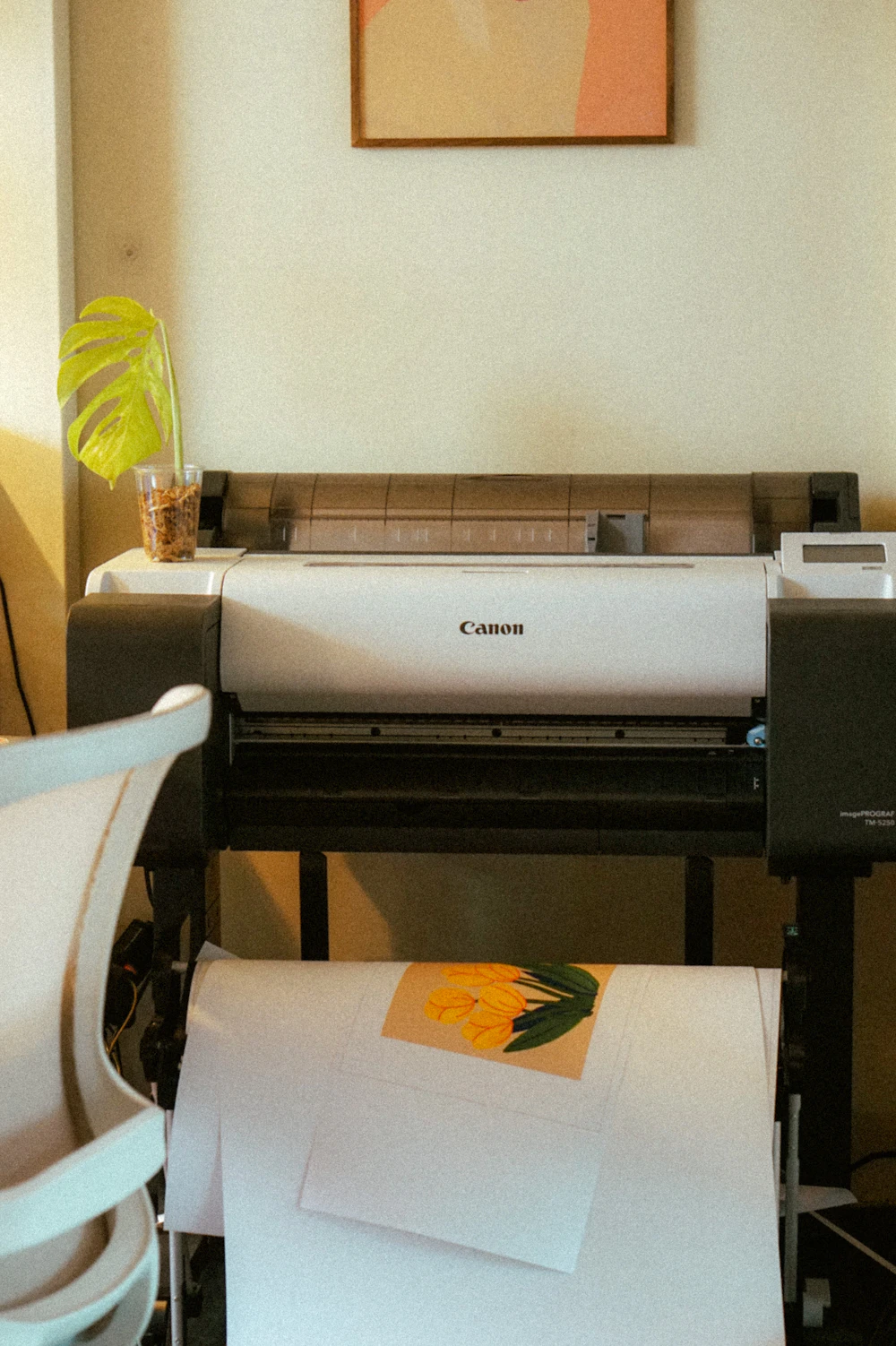 Large format printer producing branded artwork
