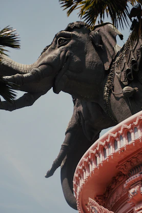 A large elephant statue decorated with ornate carvings.
