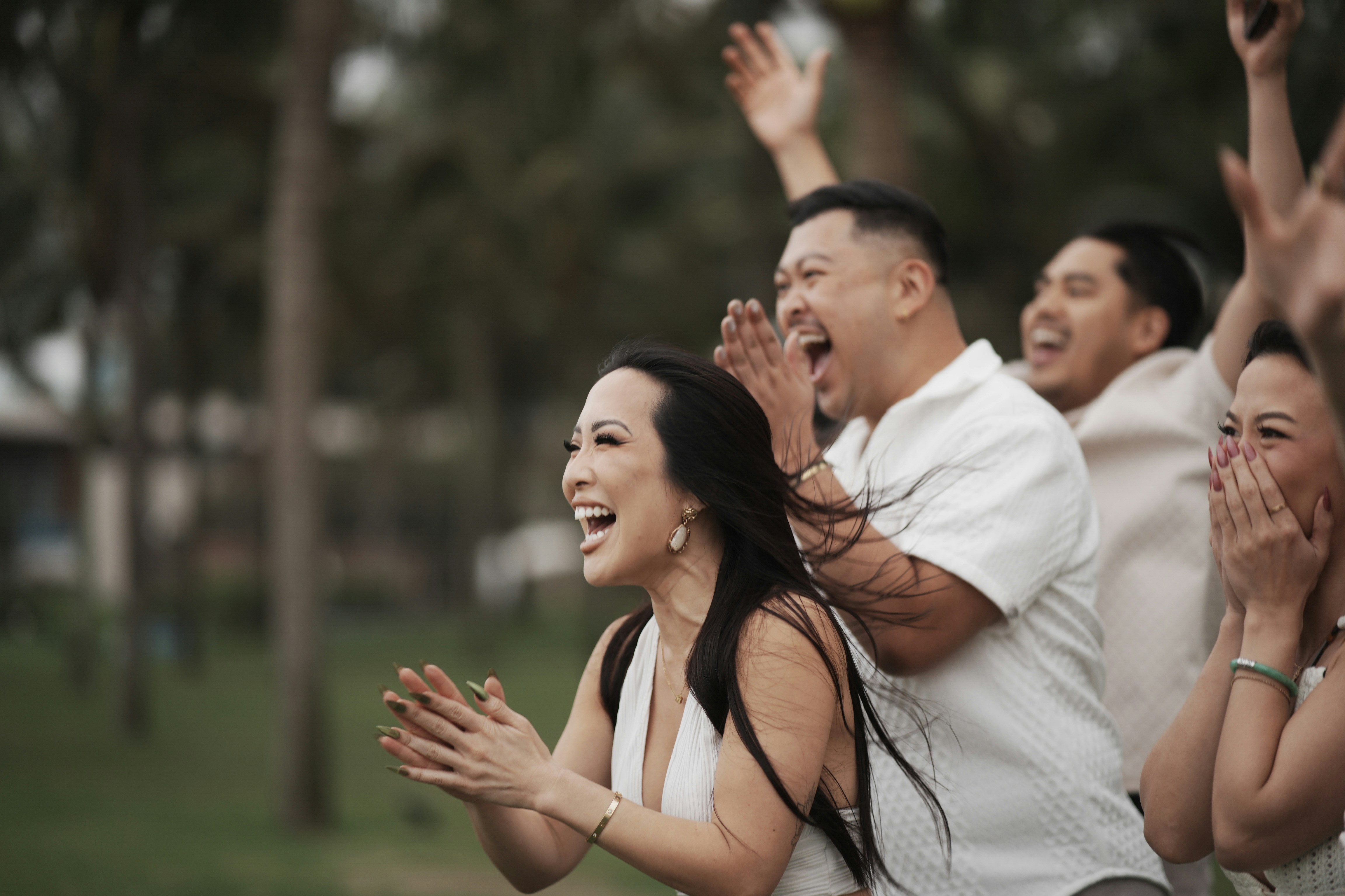 Group of people cheering and celebrating outdoors photo – Free ...