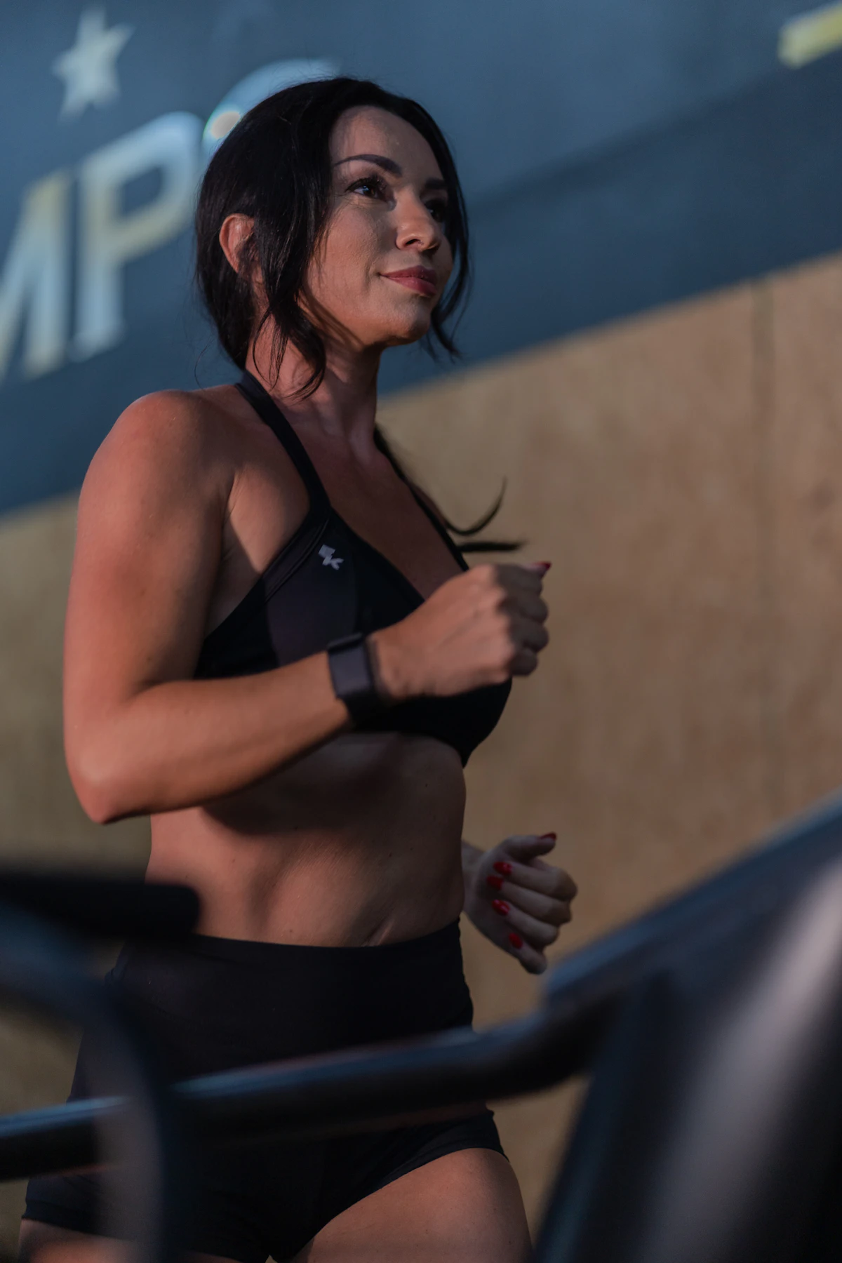 Woman running on a treadmill during a cardio workout