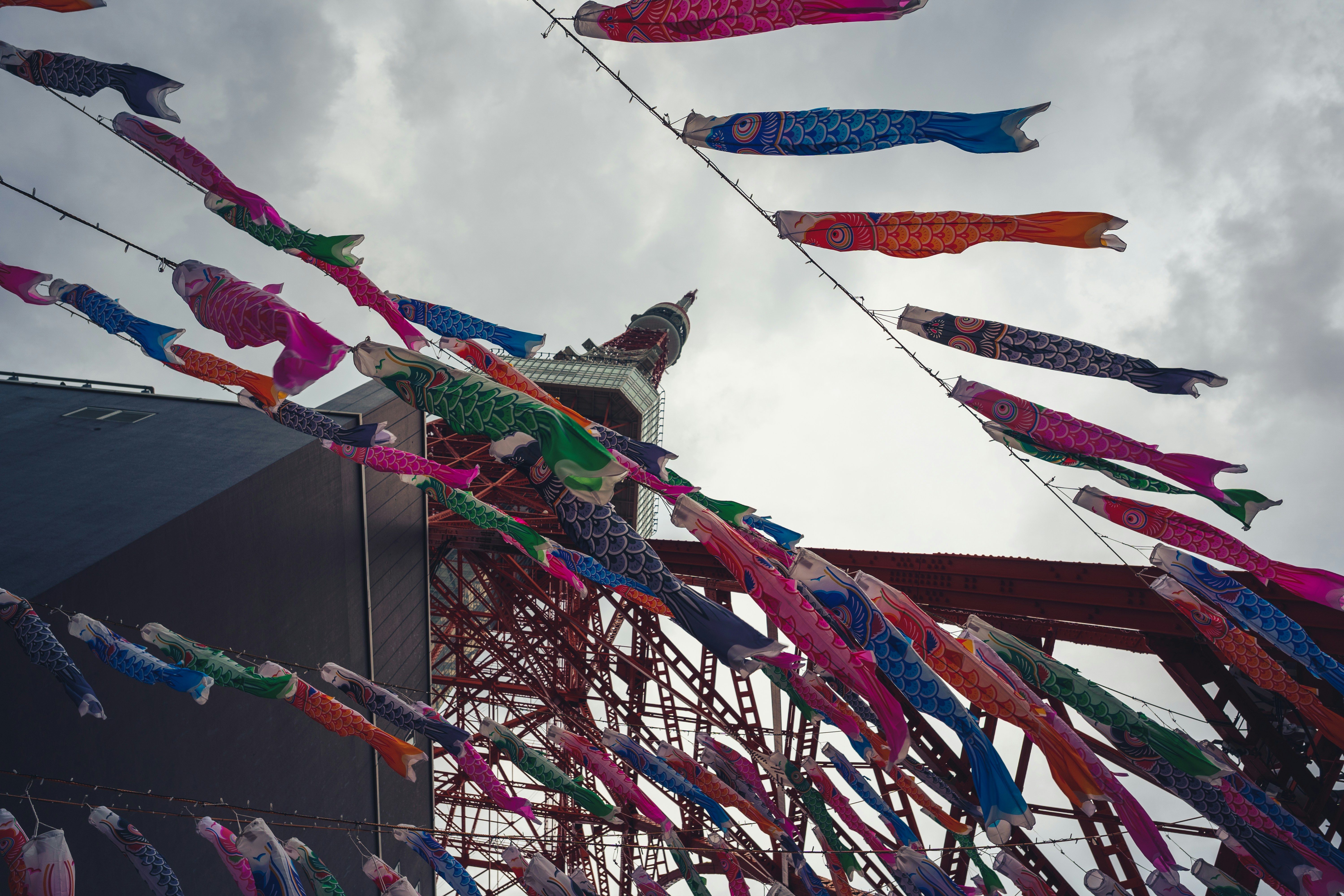 Colorful carp streamers flying against a cloudy sky