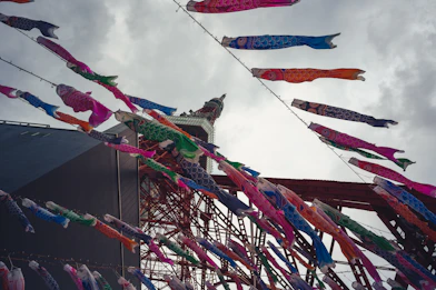 Colorful carp streamers flying against a cloudy sky