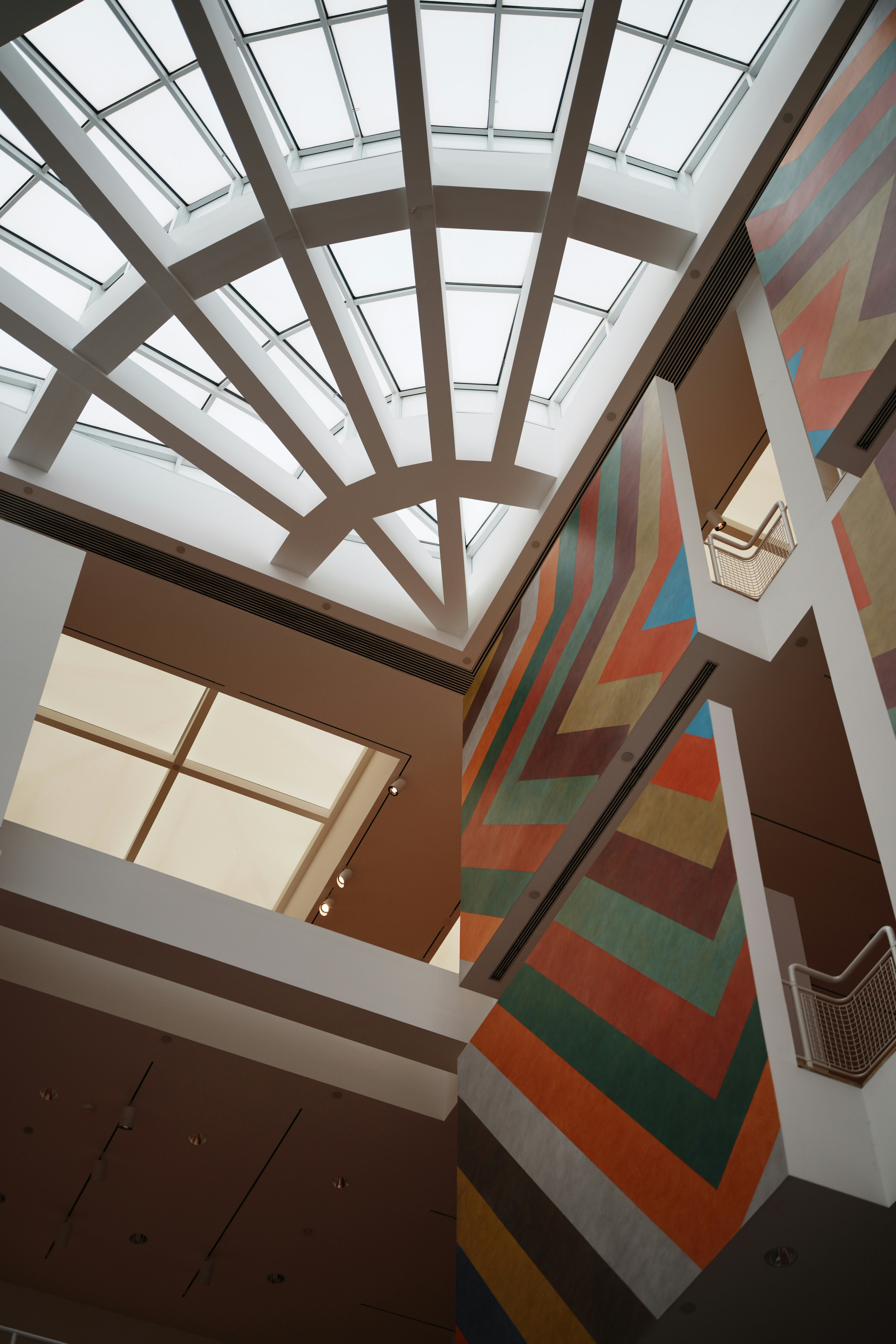 Modern building interior with colorful geometric mural