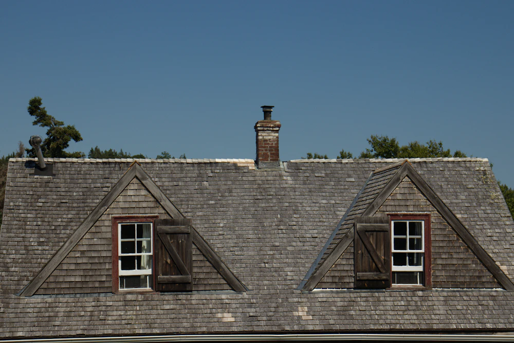 Shingled roof with dormer windows