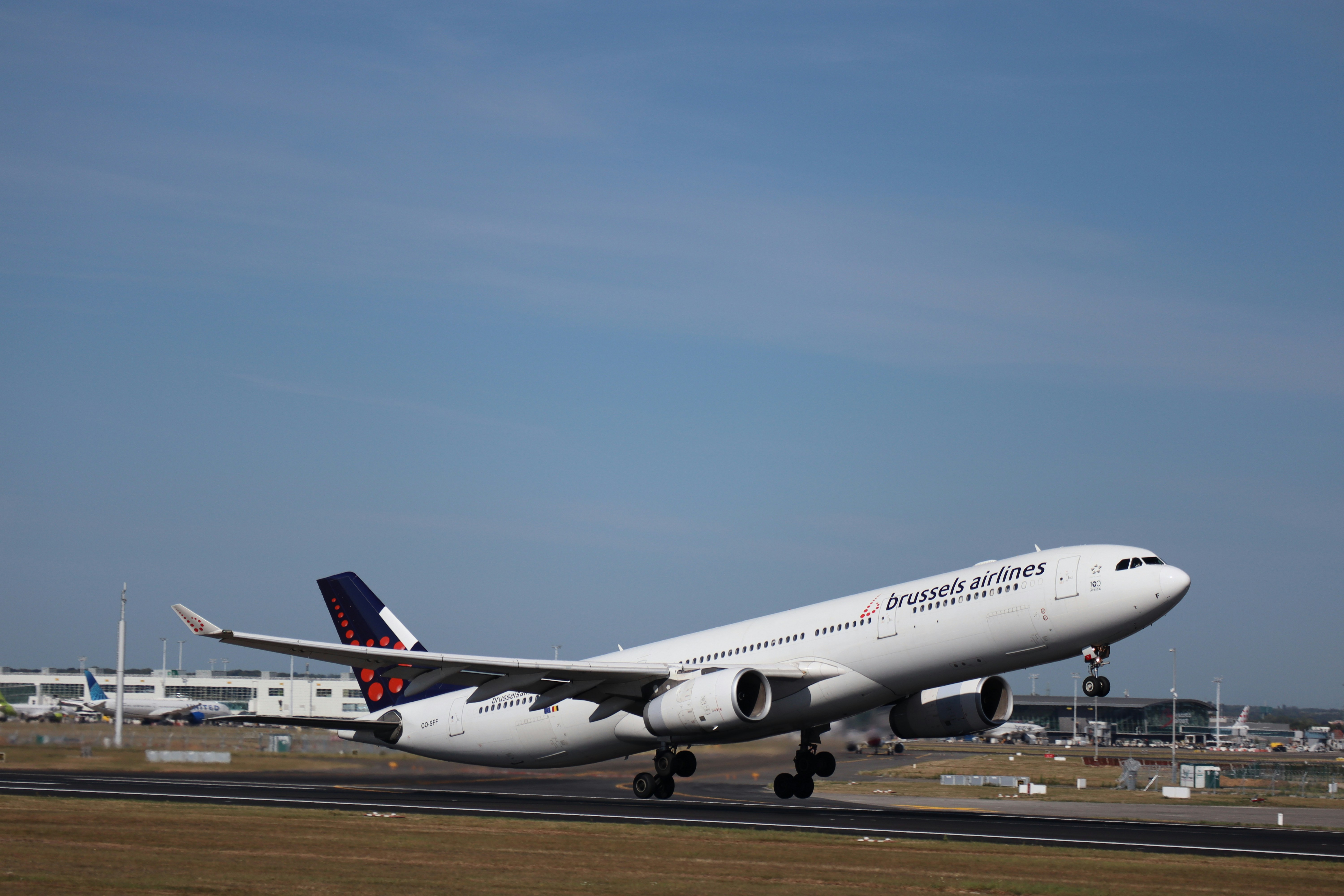 Airplane taking off into a clear blue sky