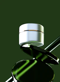 White cosmetic jar balanced on green reflective objects