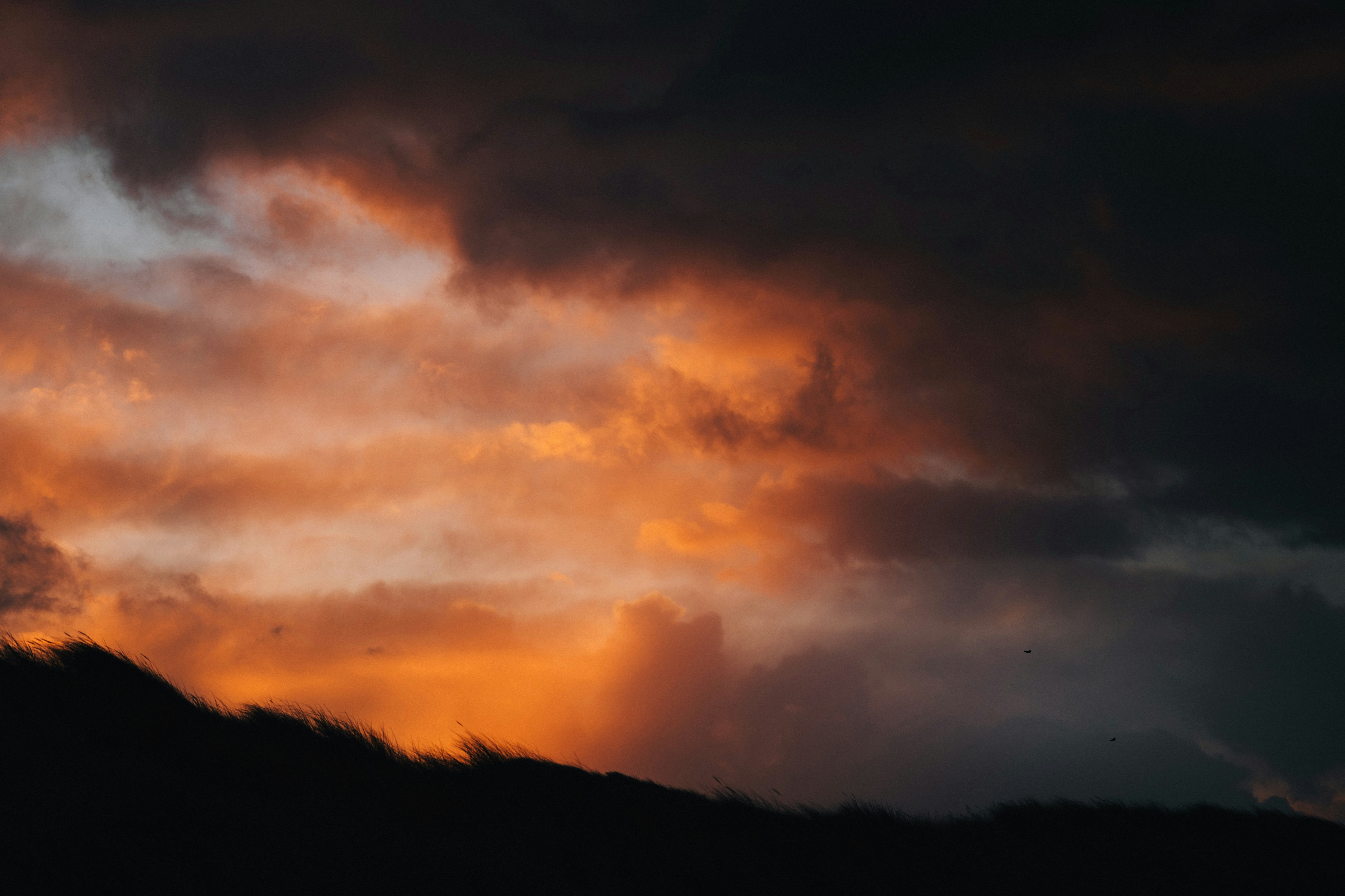 Dramatic sunset clouds with fiery orange hues