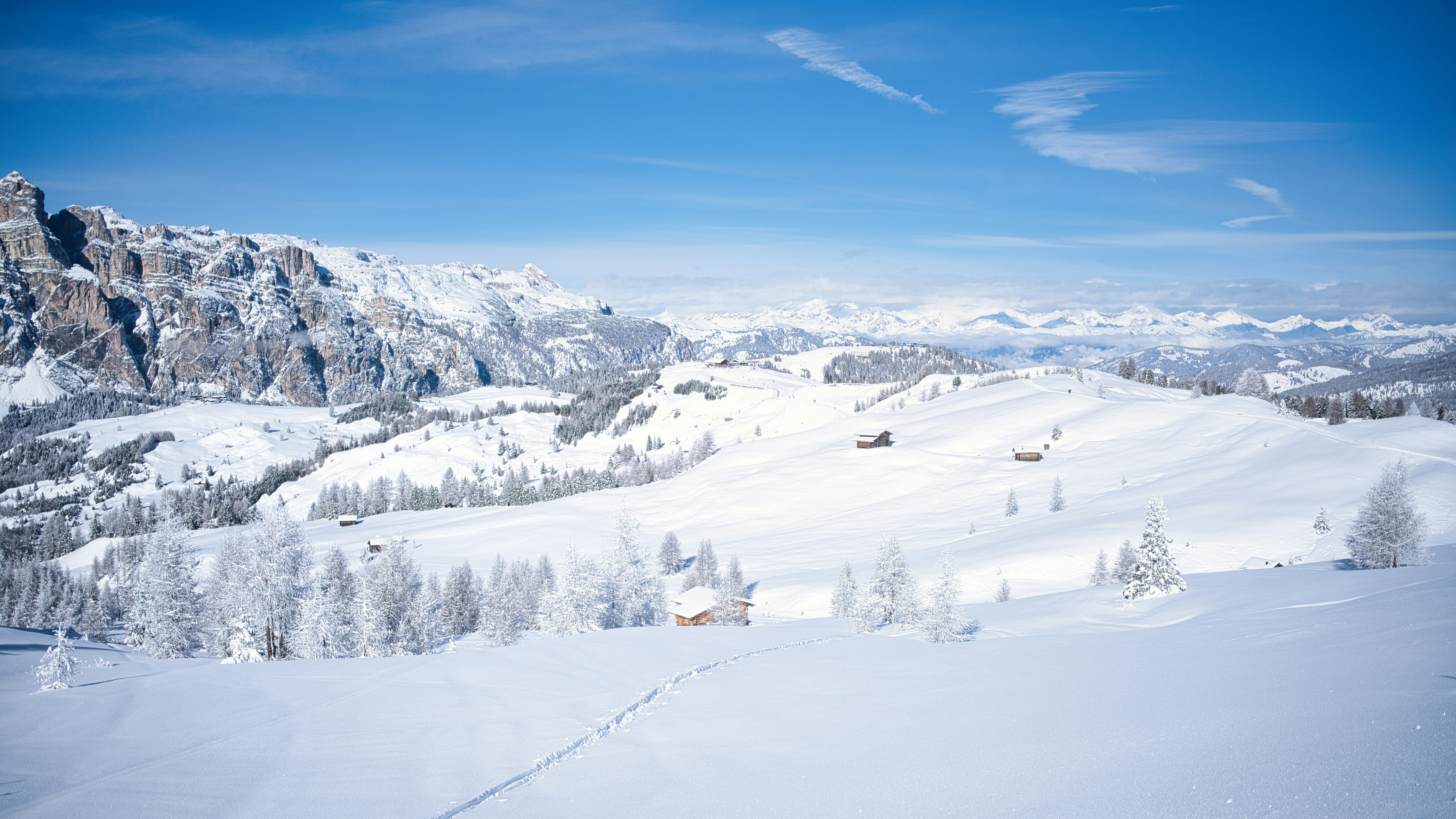 Snowy mountain landscape with clear blue sky
