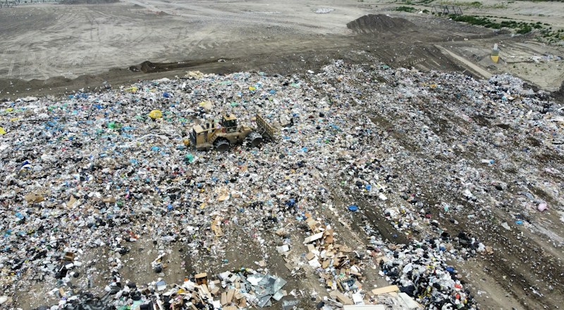 A bulldozer compacting trash at a large landfill, the kind of waste Forge Industries plans to divert from the Apex landfill in Southern Nevada