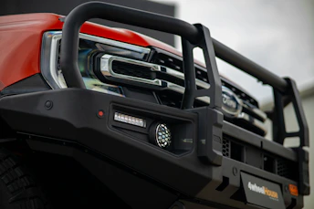 Front view of a red truck with bull bar