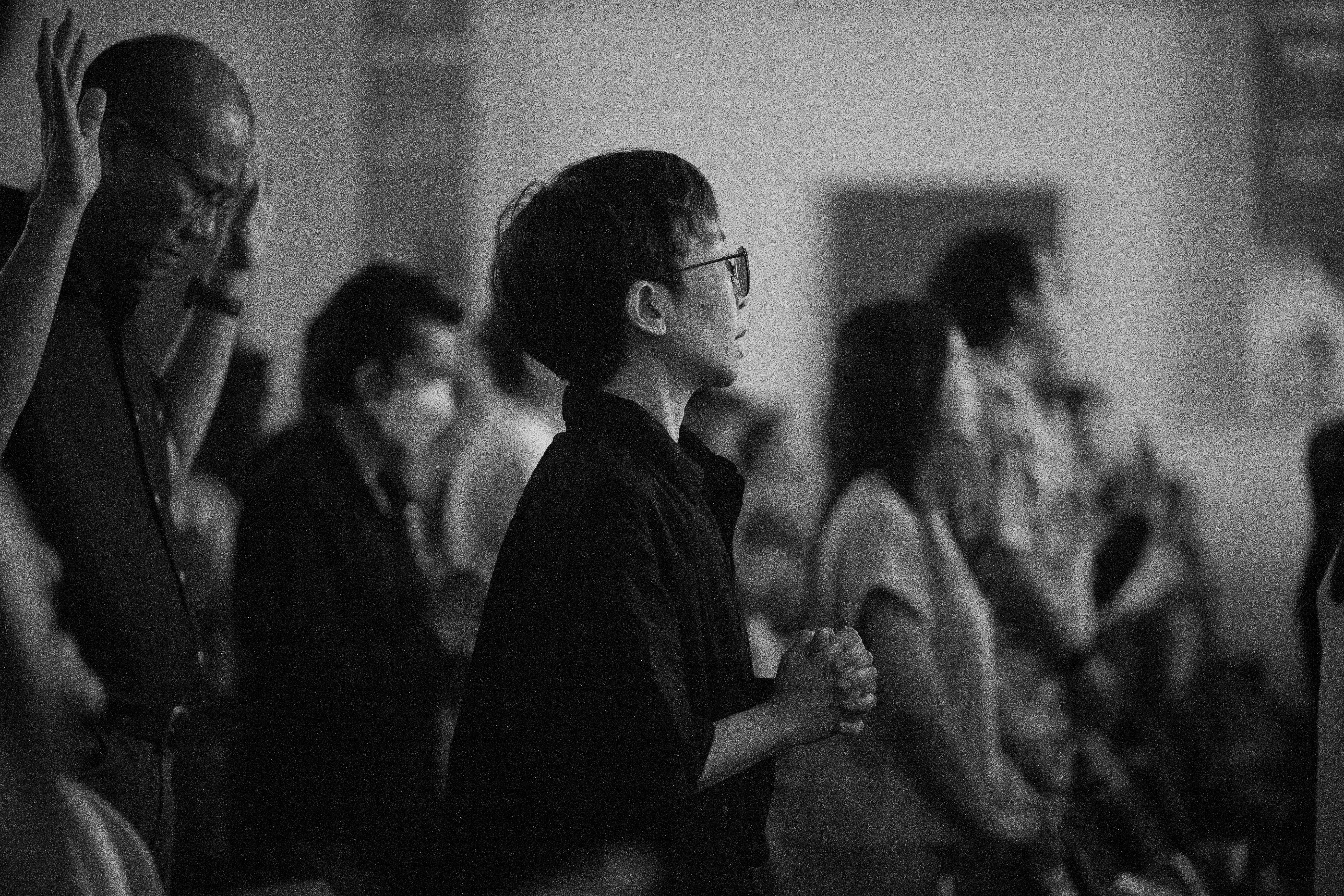 People standing and praying in a church