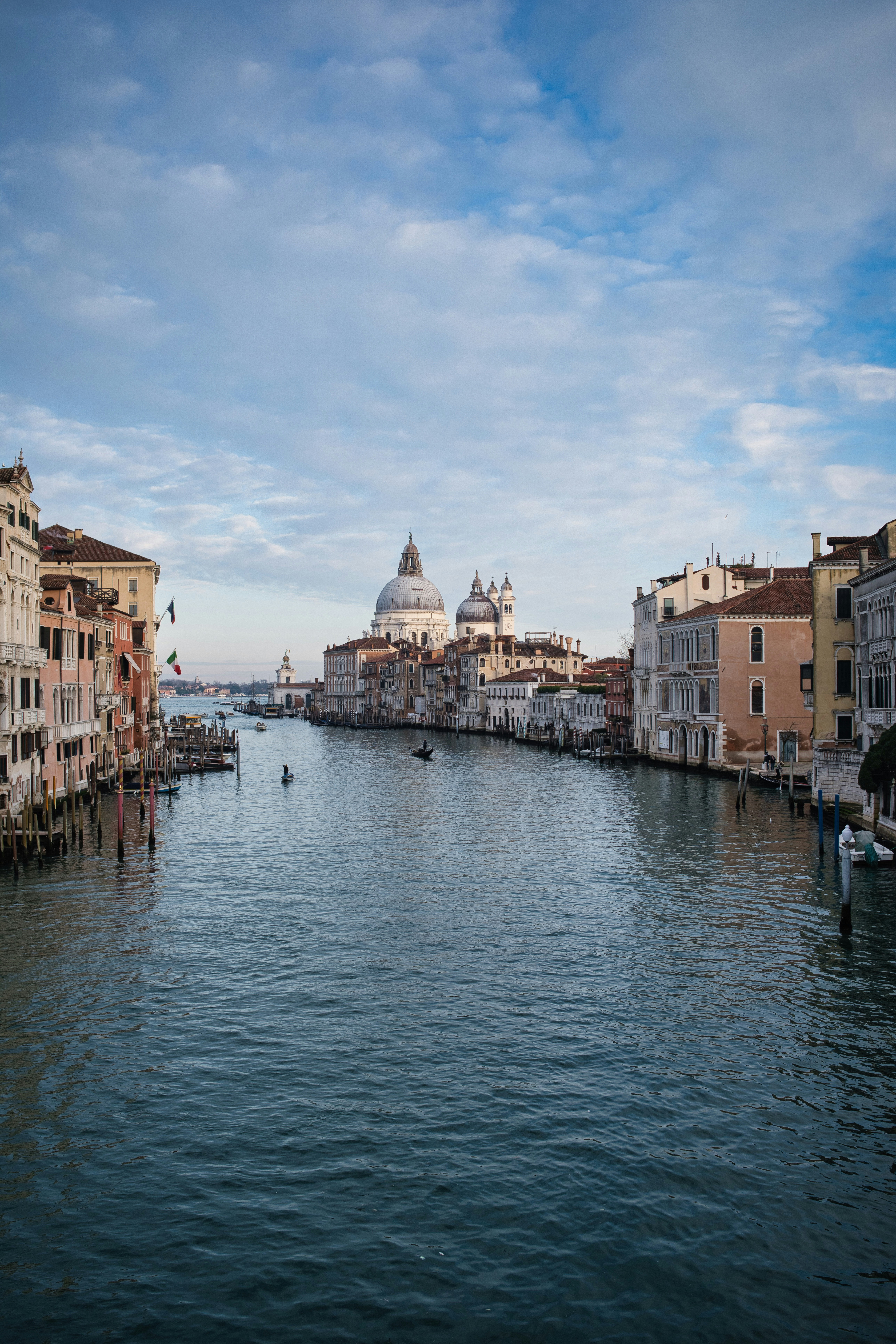 Venice canal with historic buildings and dome