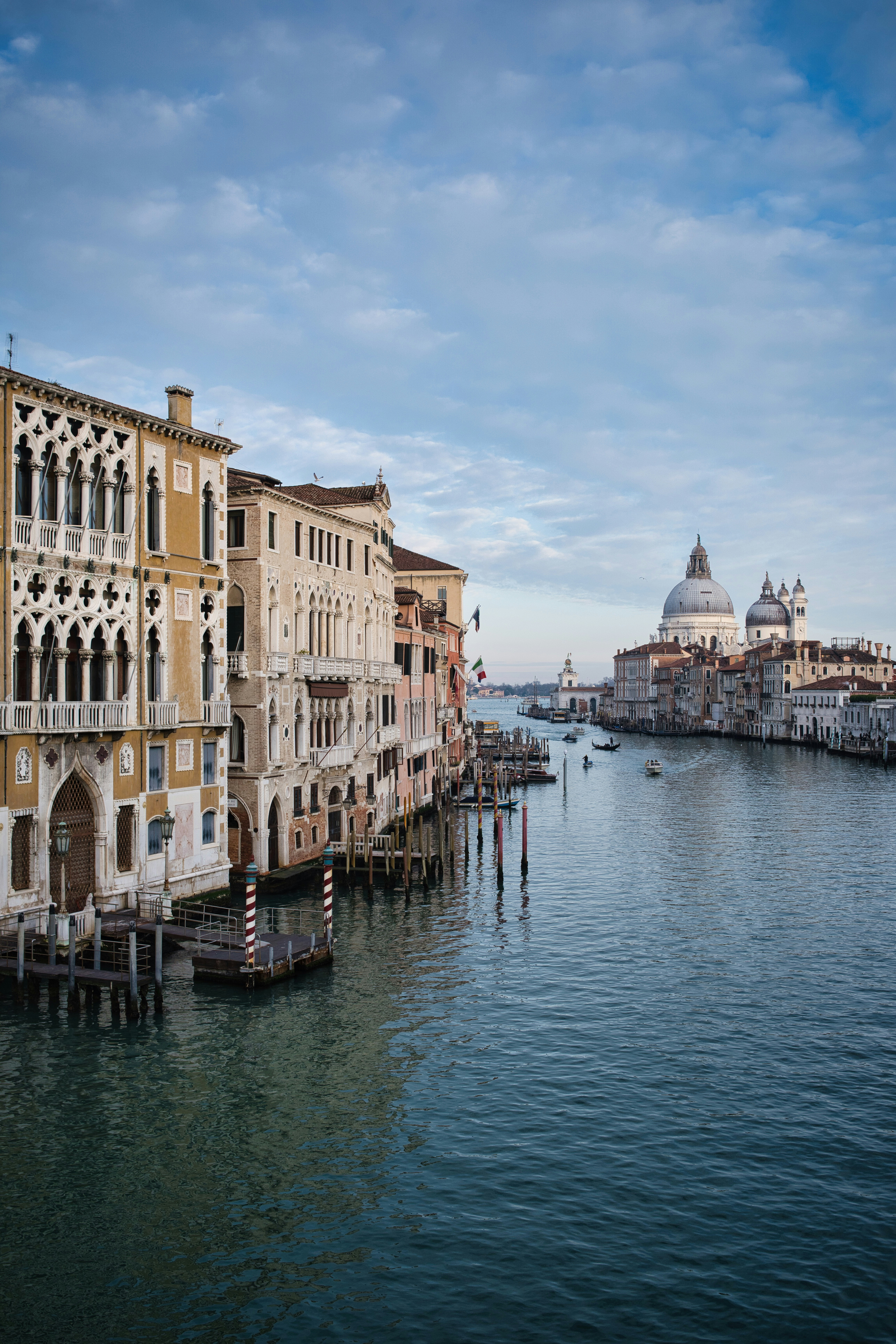 Venice canal with historic buildings and distant church