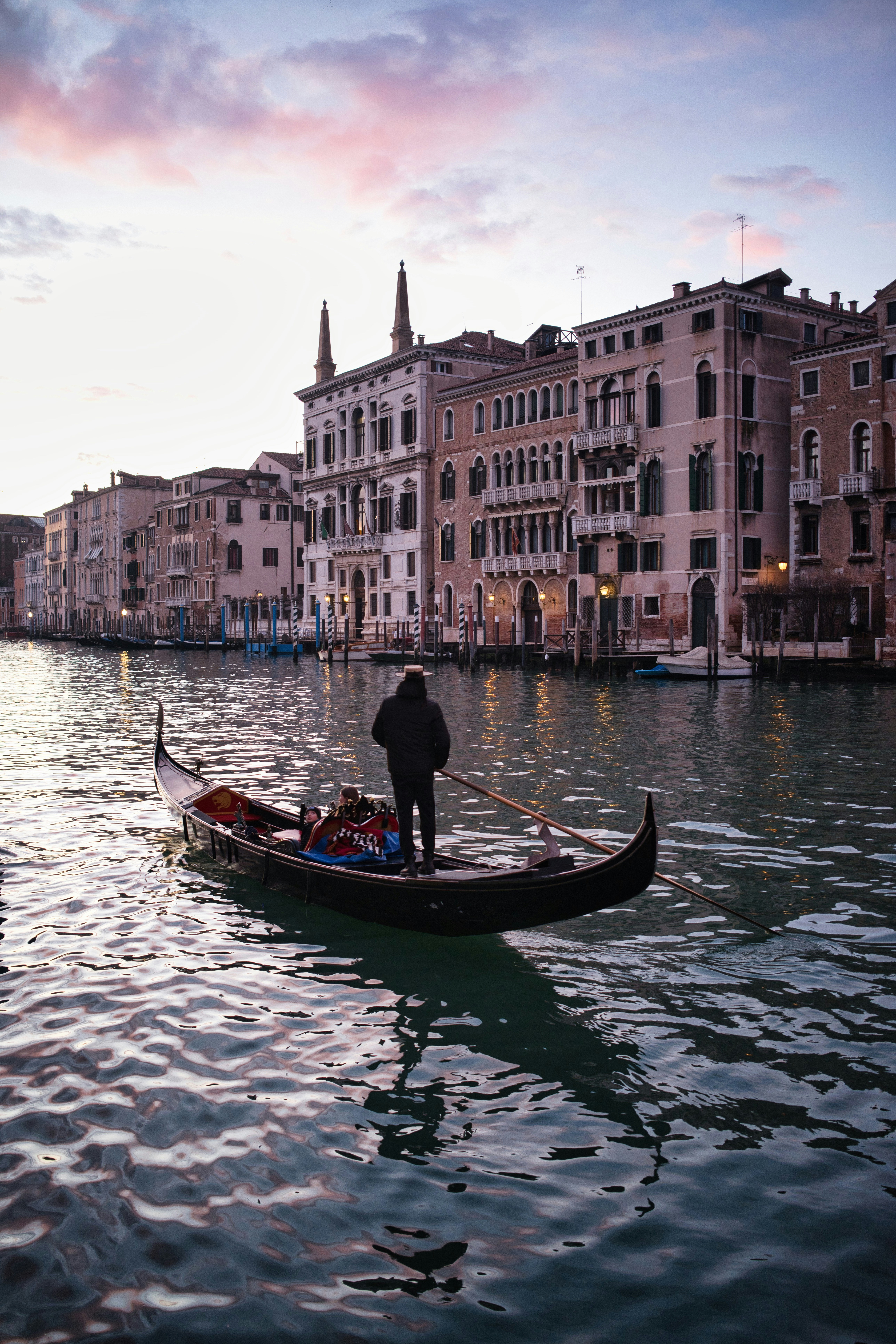 Gondola on canal with buildings in venice