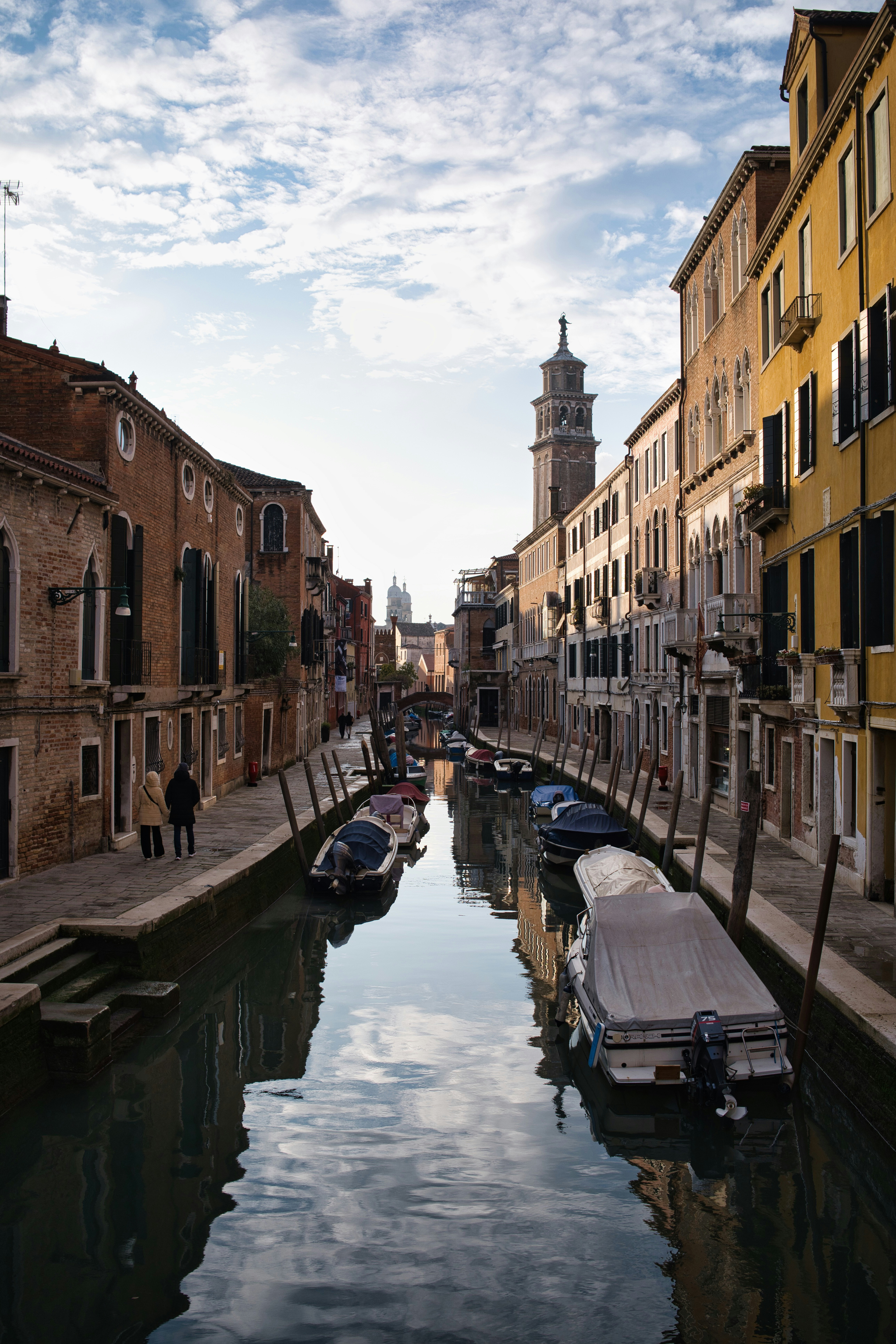 Canal in venice with boats and historic buildings