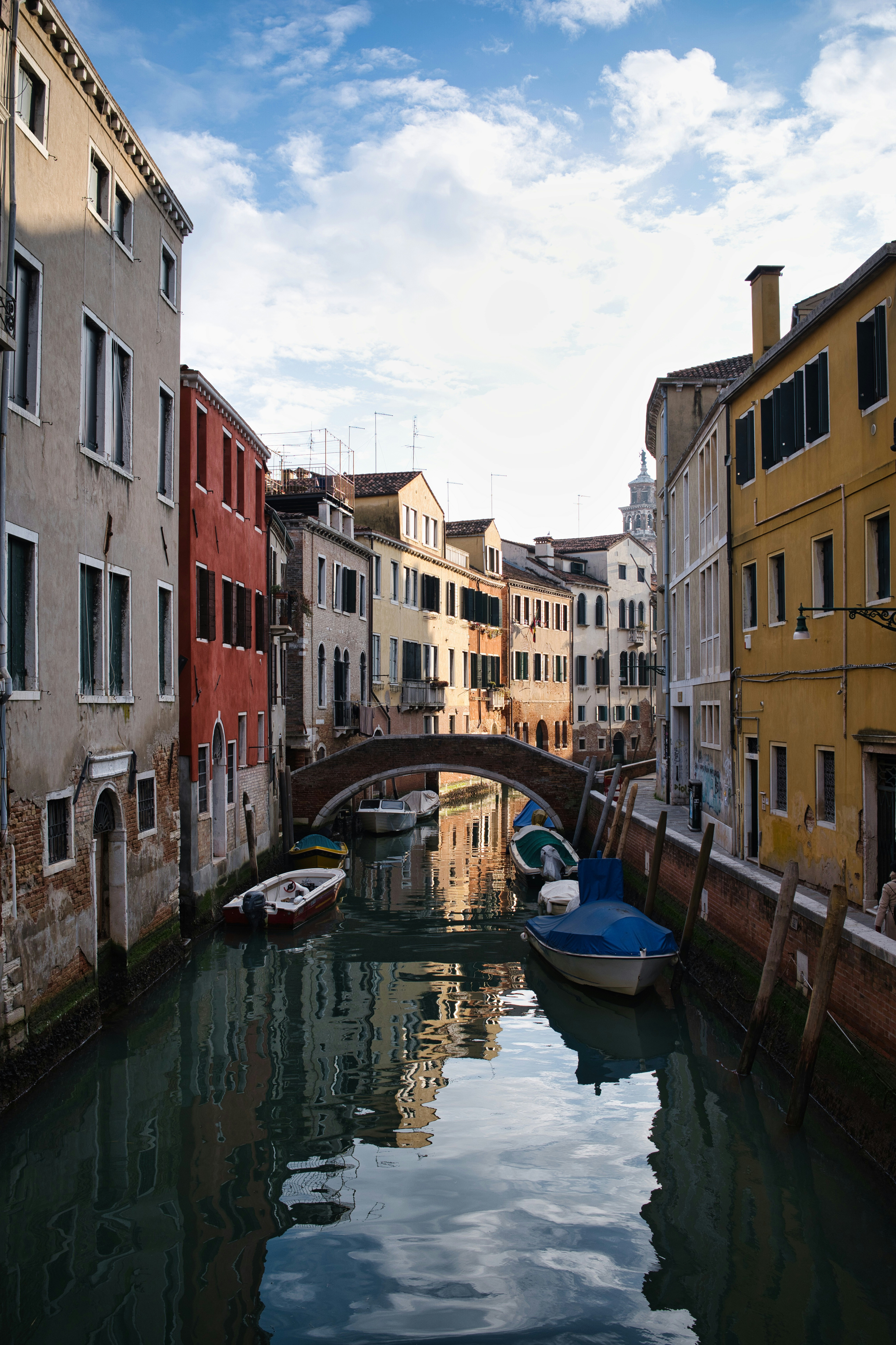 Canal with boats and old buildings in venice