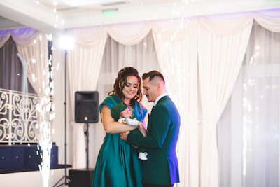 Couple embracing with sparklers at a formal event