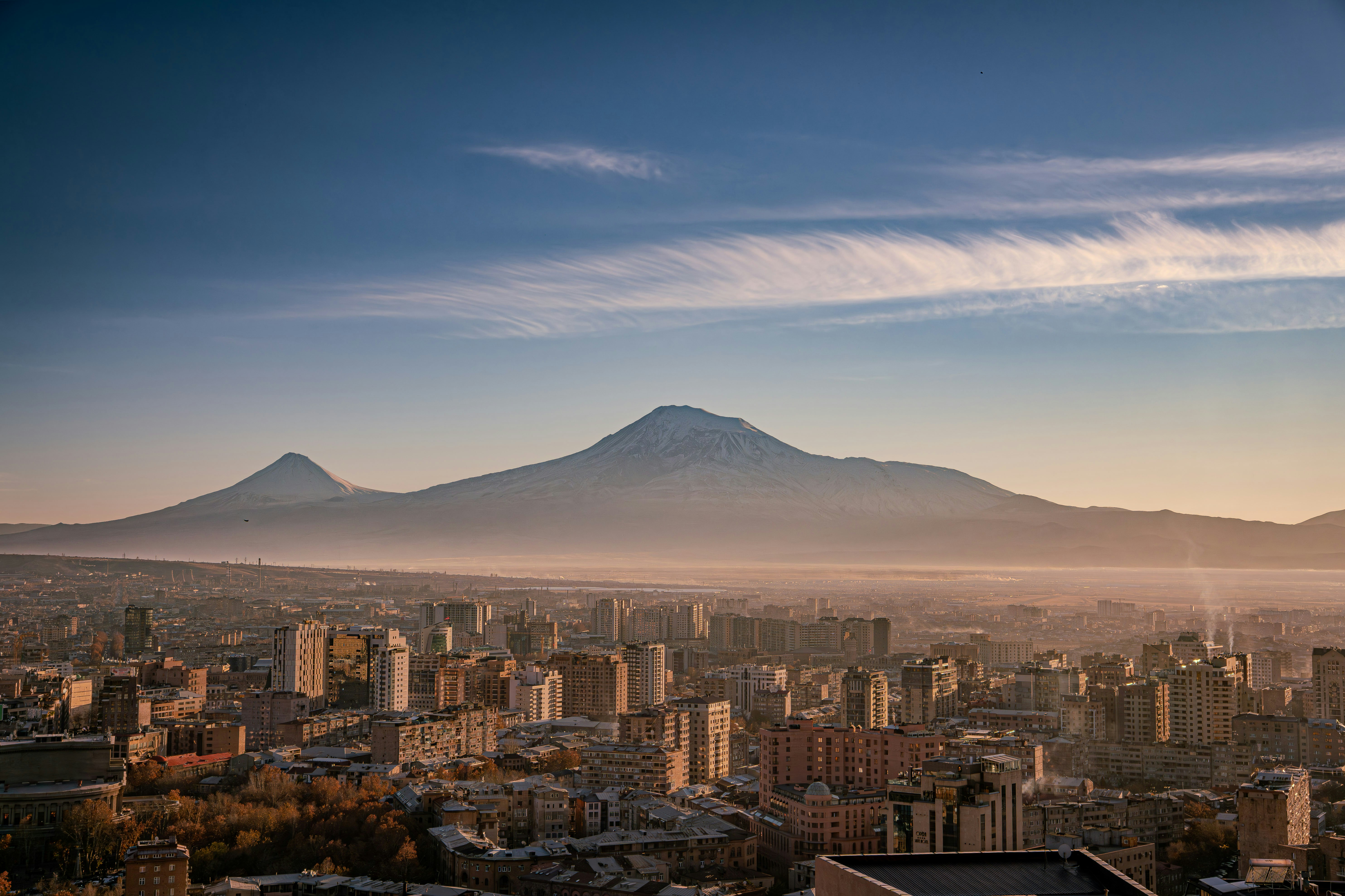 City skyline with mount ararat in the background at sunrise