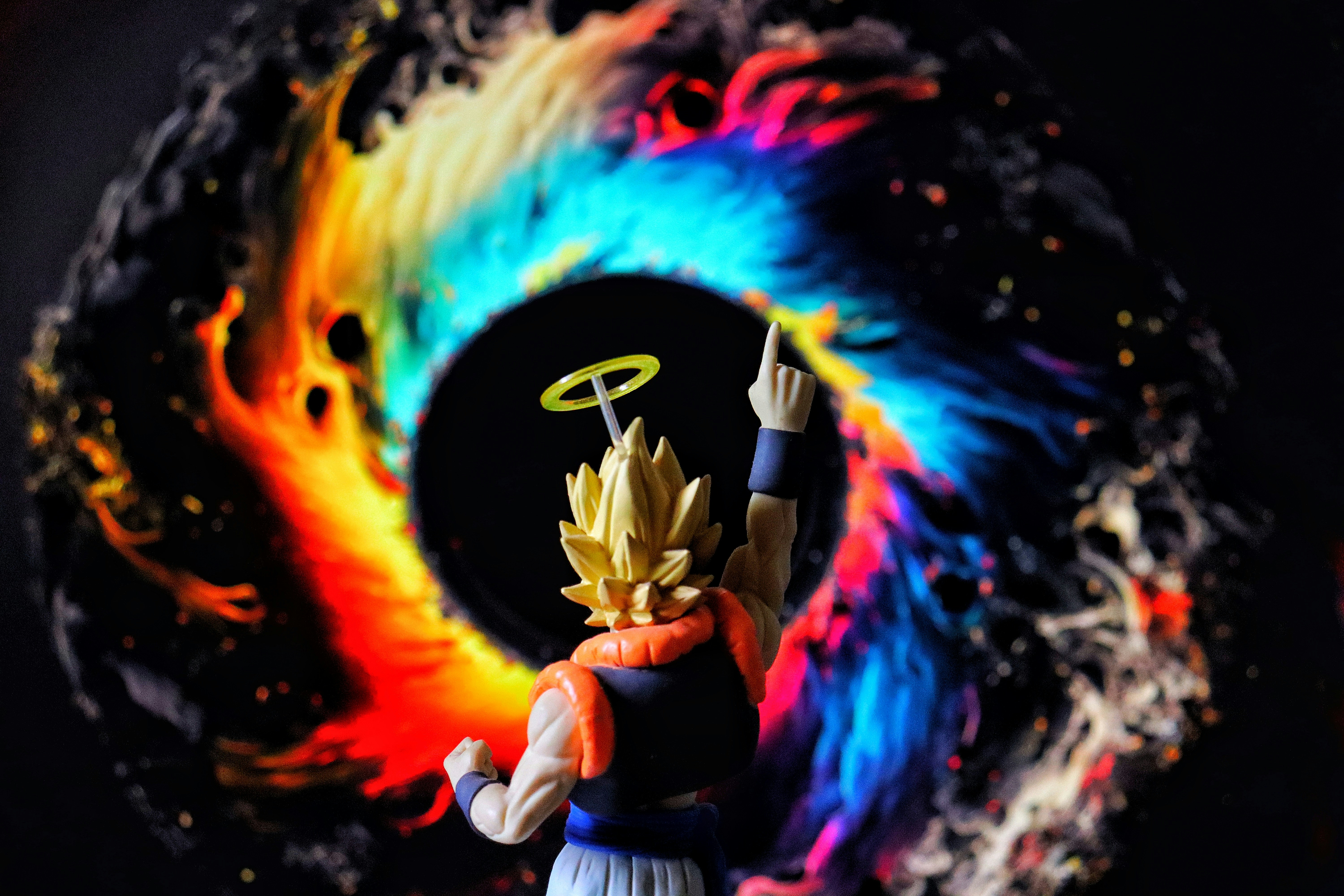 Figure with halo points finger at colorful vortex