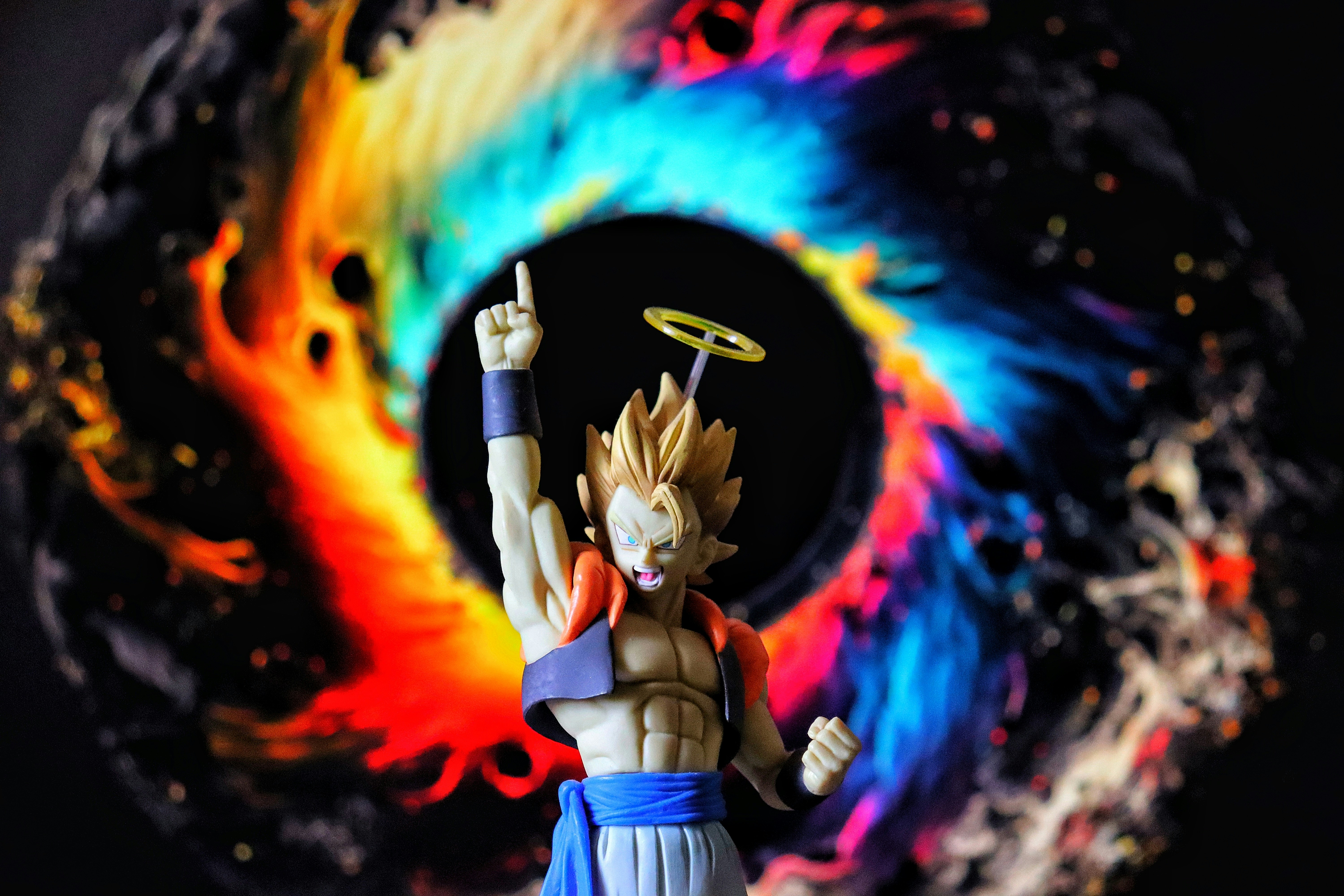 A colorful, abstract vortex behind a toy figure.