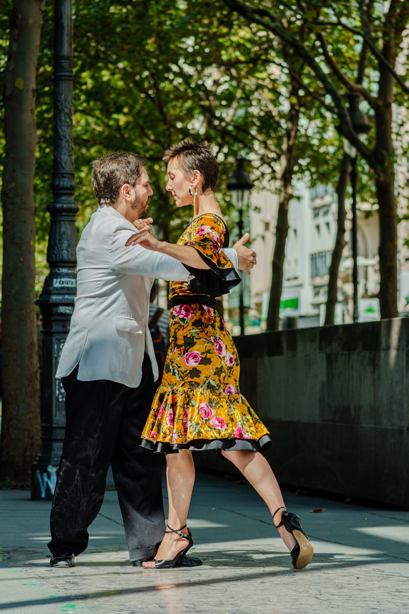 Couple dancing salsa under warm lights