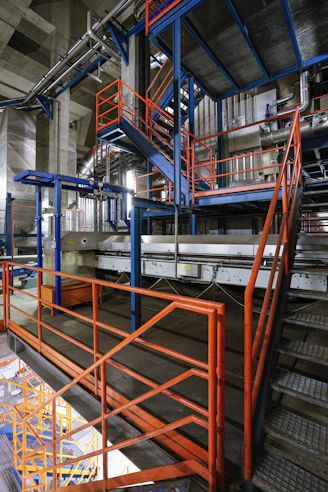 Industrial interior with stairs and machinery