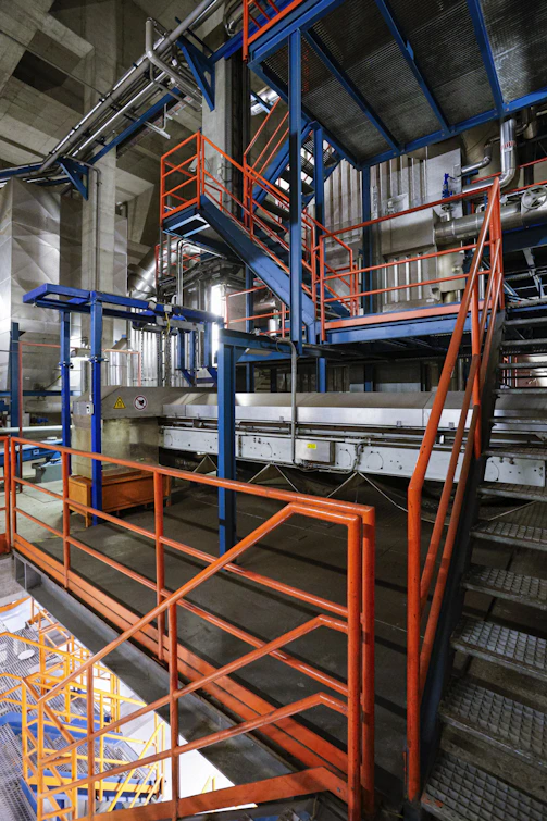 Industrial interior with stairs and machinery