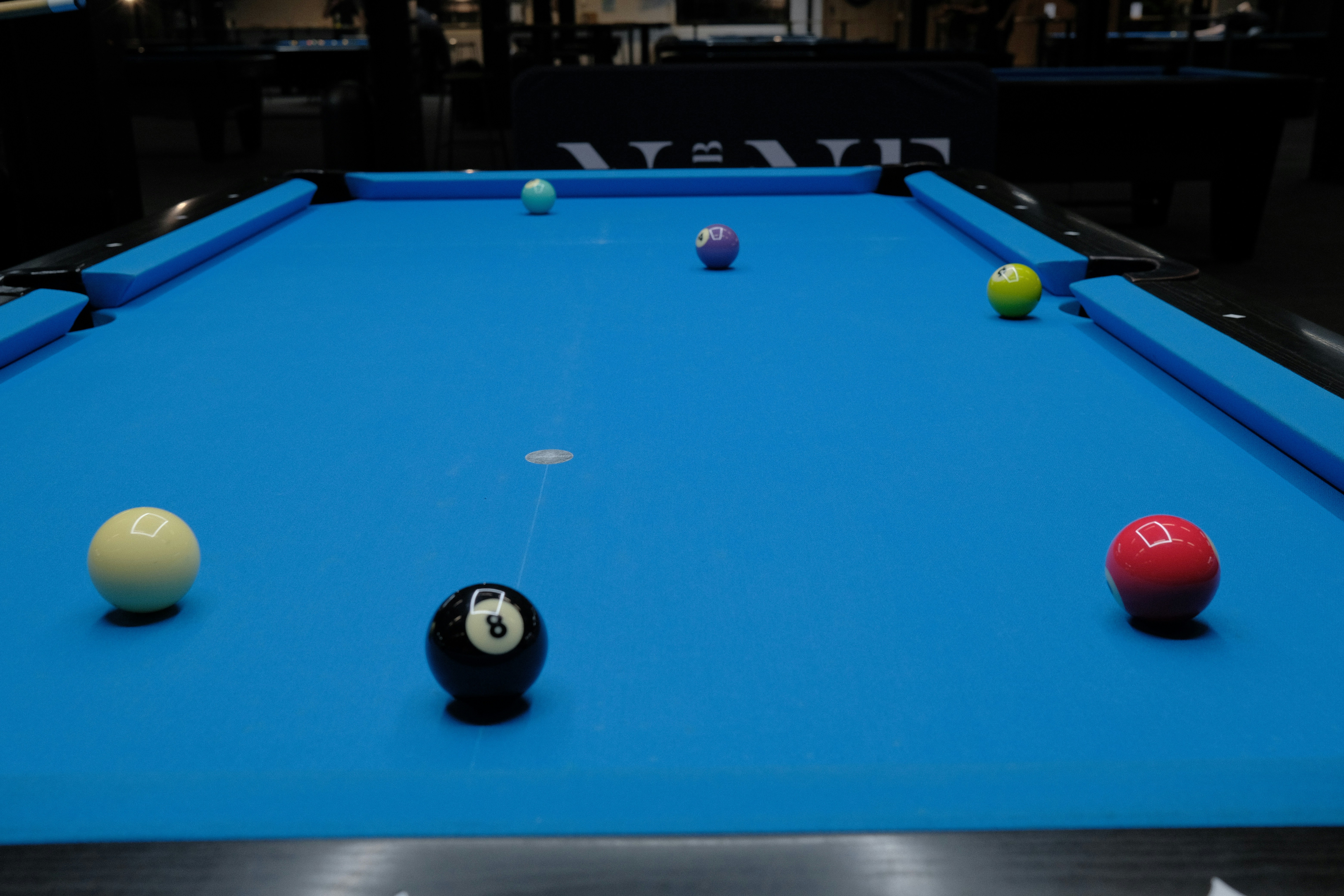 Billiard balls on a blue pool table