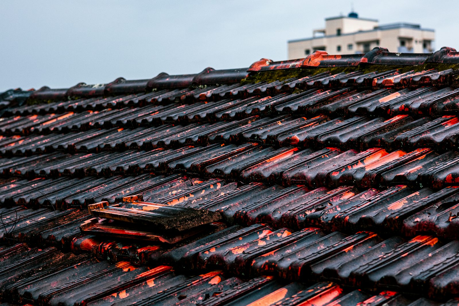 Close-up of damaged roof tiles requiring repair