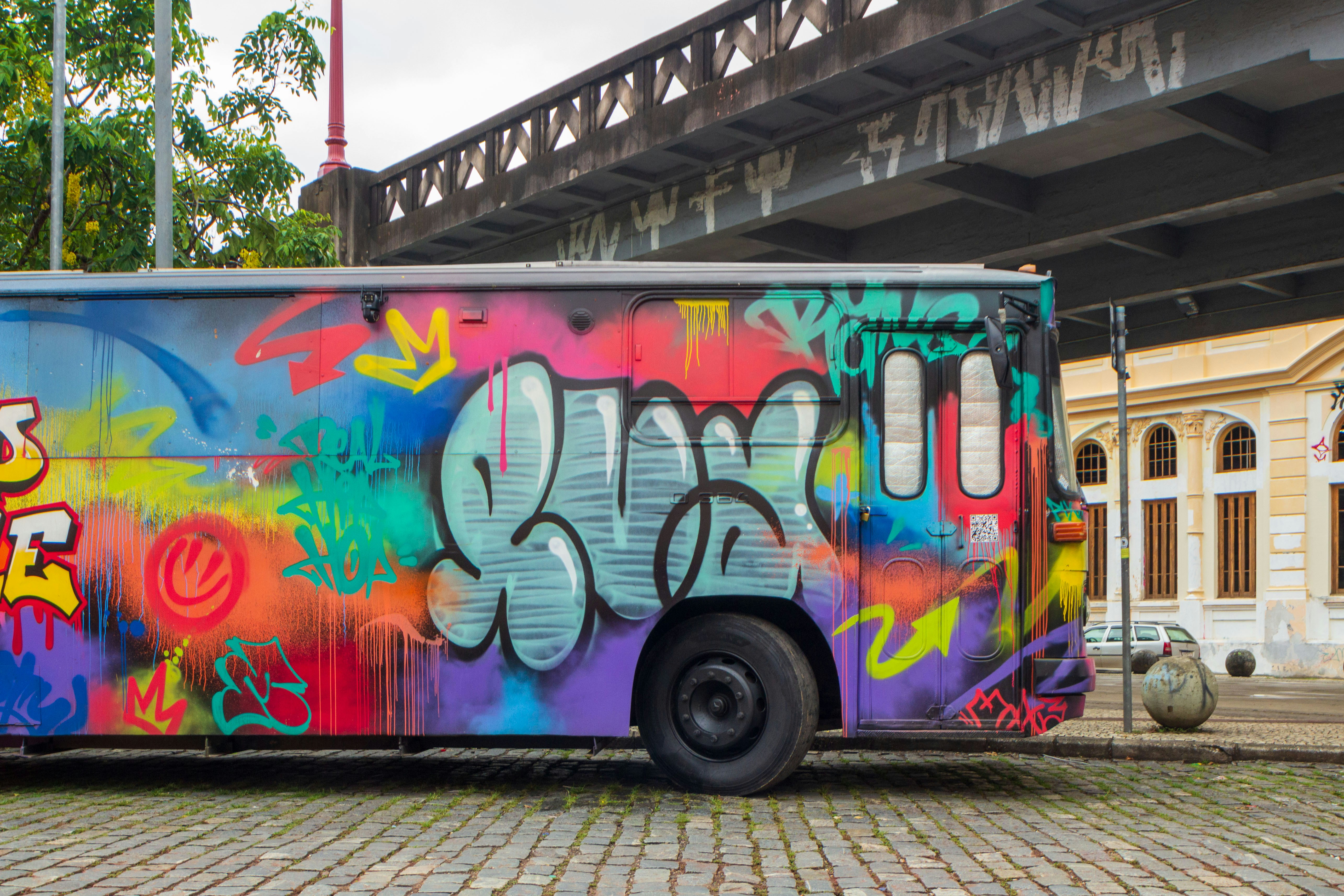 A bus covered in colorful graffiti art