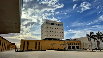 Modern building with circular windows under blue sky