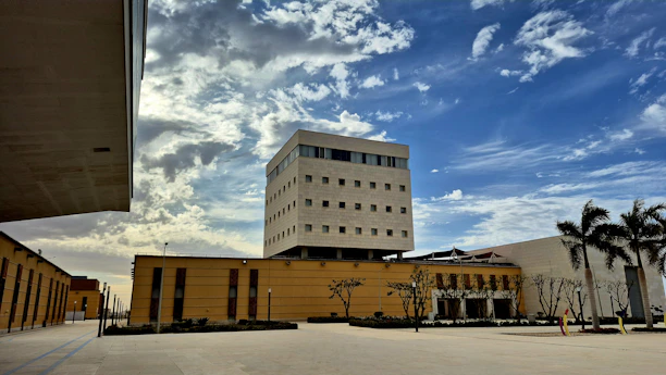 Modern building with circular windows under blue sky