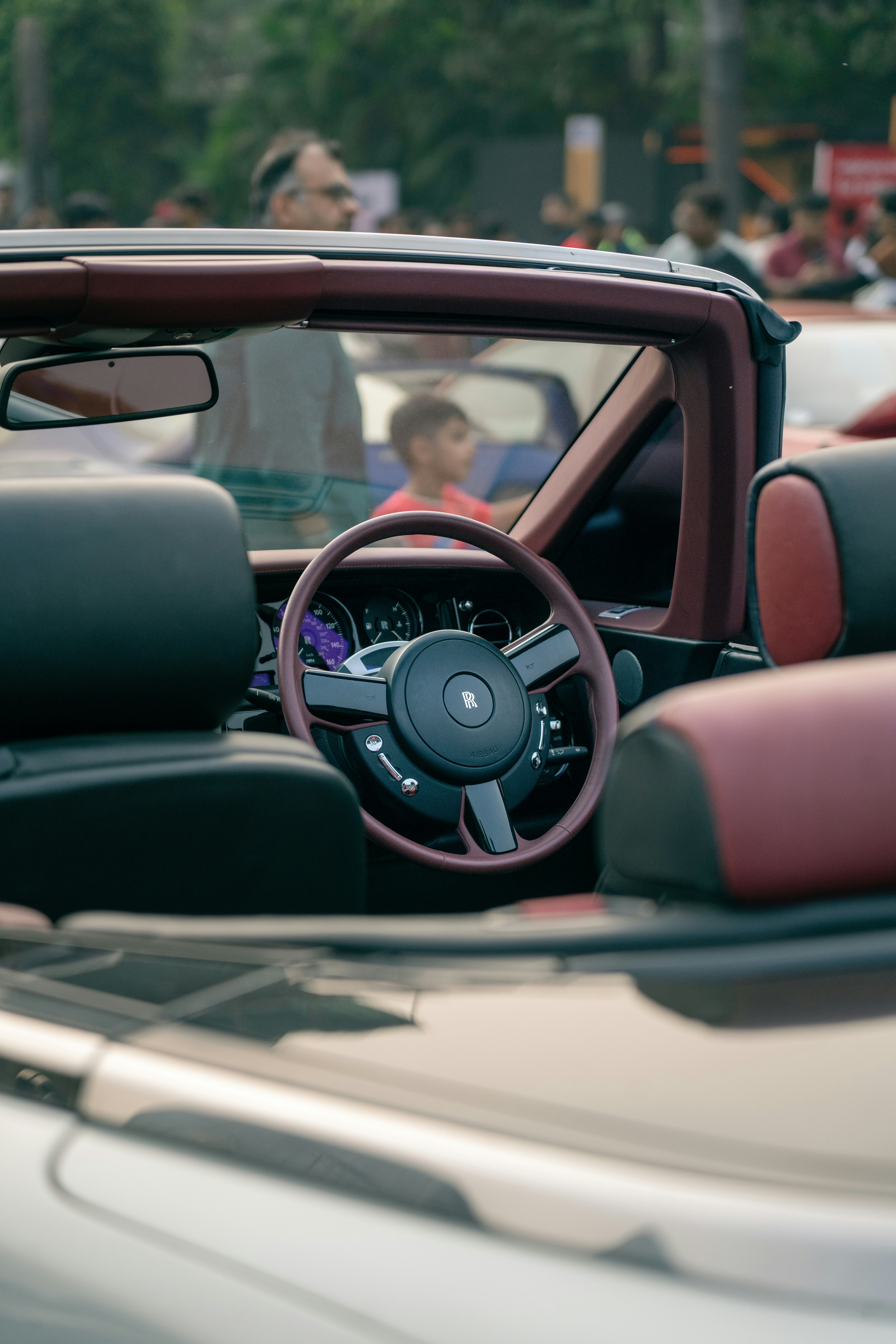 Interior of a luxury convertible car with leather seats.