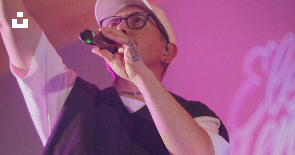Songer Rapper Show A rapper performs on stage with a microphone. photo – Free Music Image ...