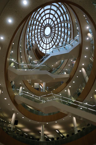 Modern building interior with spiral staircase and skylight