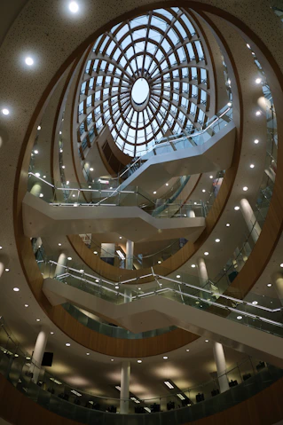 Modern building interior with spiral staircase and skylight