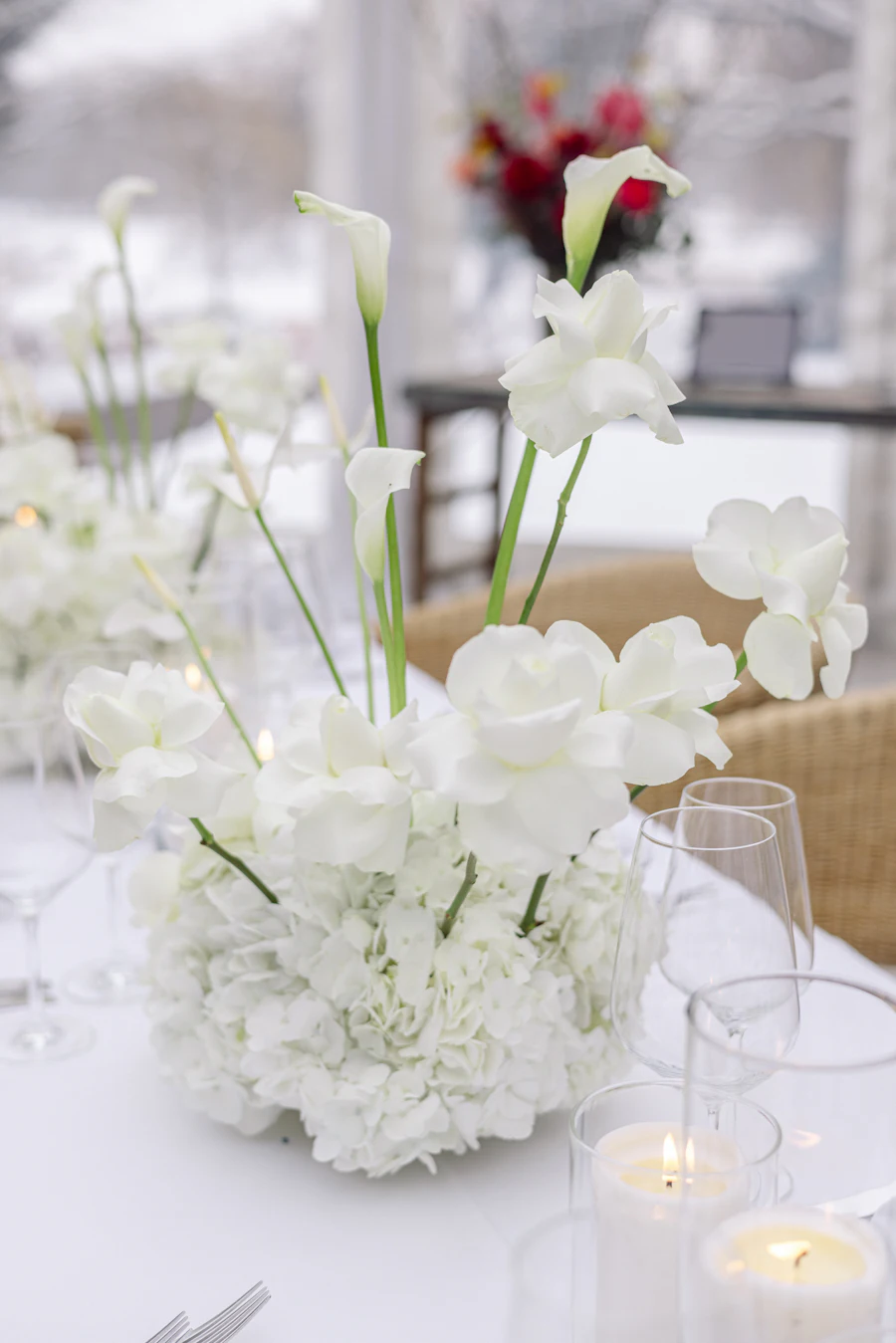 Elegant family celebration table styled with candles and refined florals