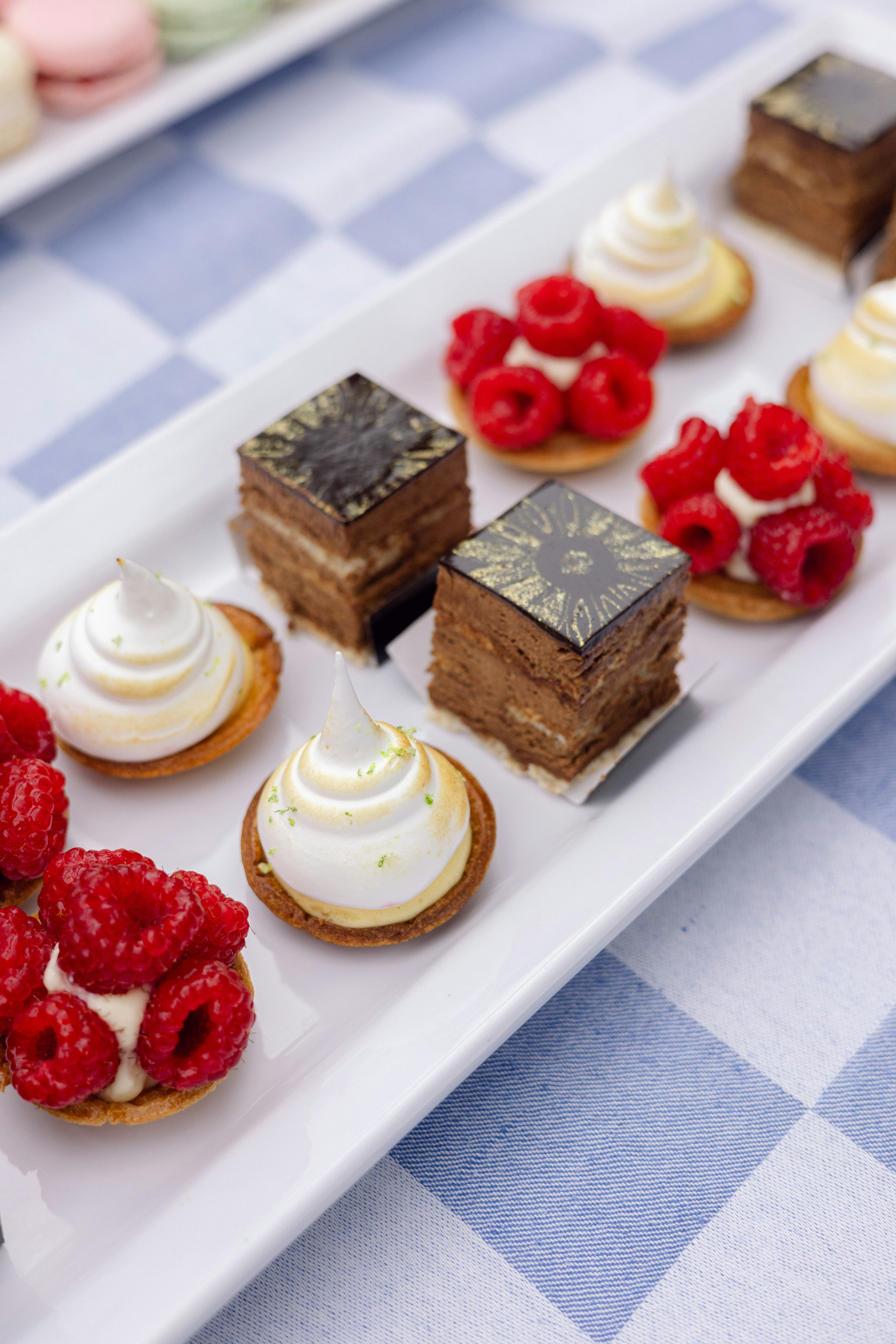 Assortment of small cakes and pastries on a platter.