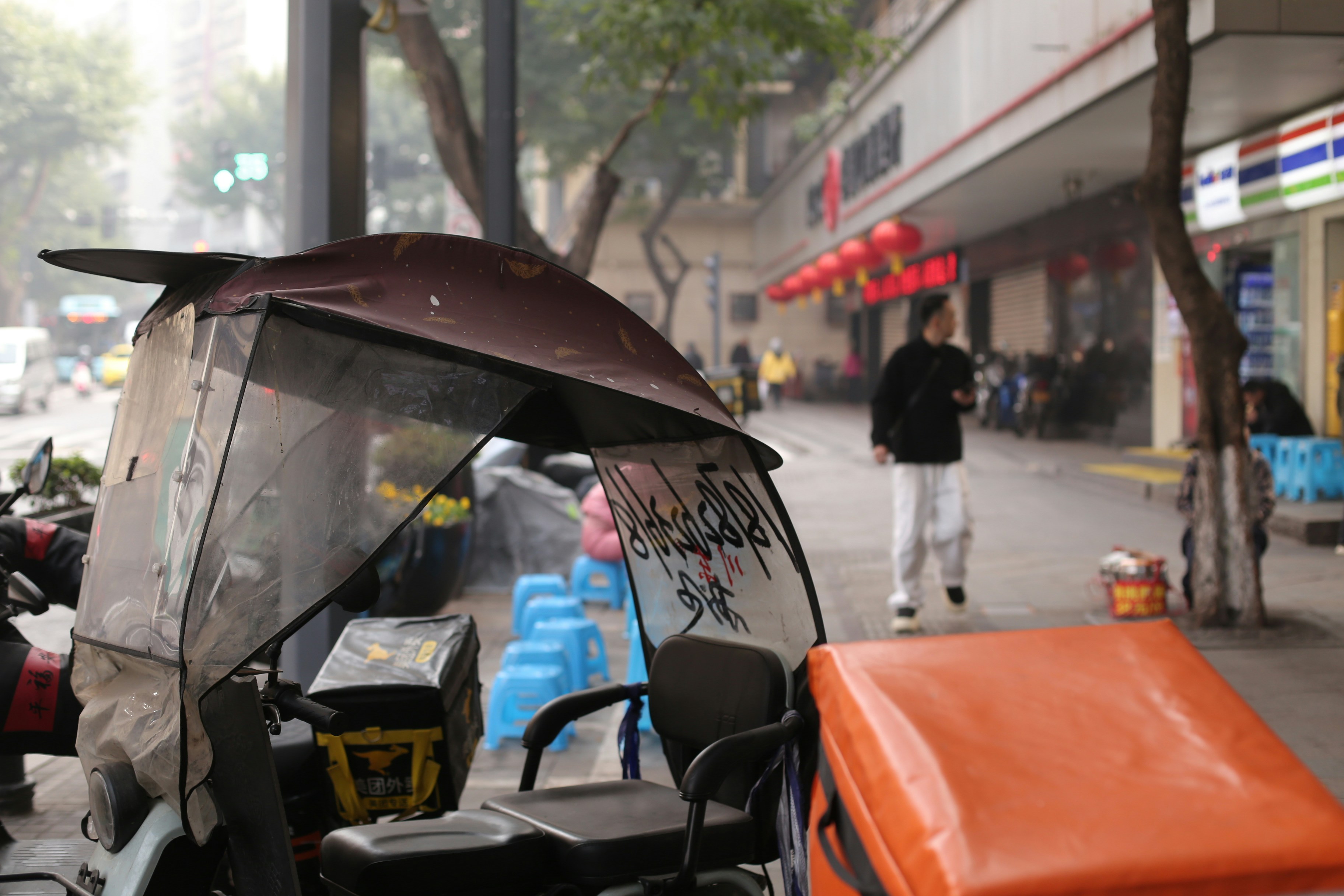 Delivery scooter parked on a city sidewalk